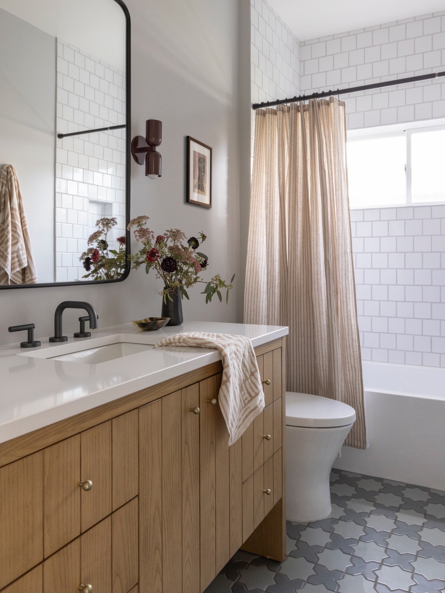 Truly obsessed with how this kids&rsquo; bath turned out.

Fireclay tile, In Common lighting, and botanicals by Studio Botanisk keep it feeling fresh, warm, and timeless (even for the messiest little humans).

Design: @riseuphome 
Photography: @sencr