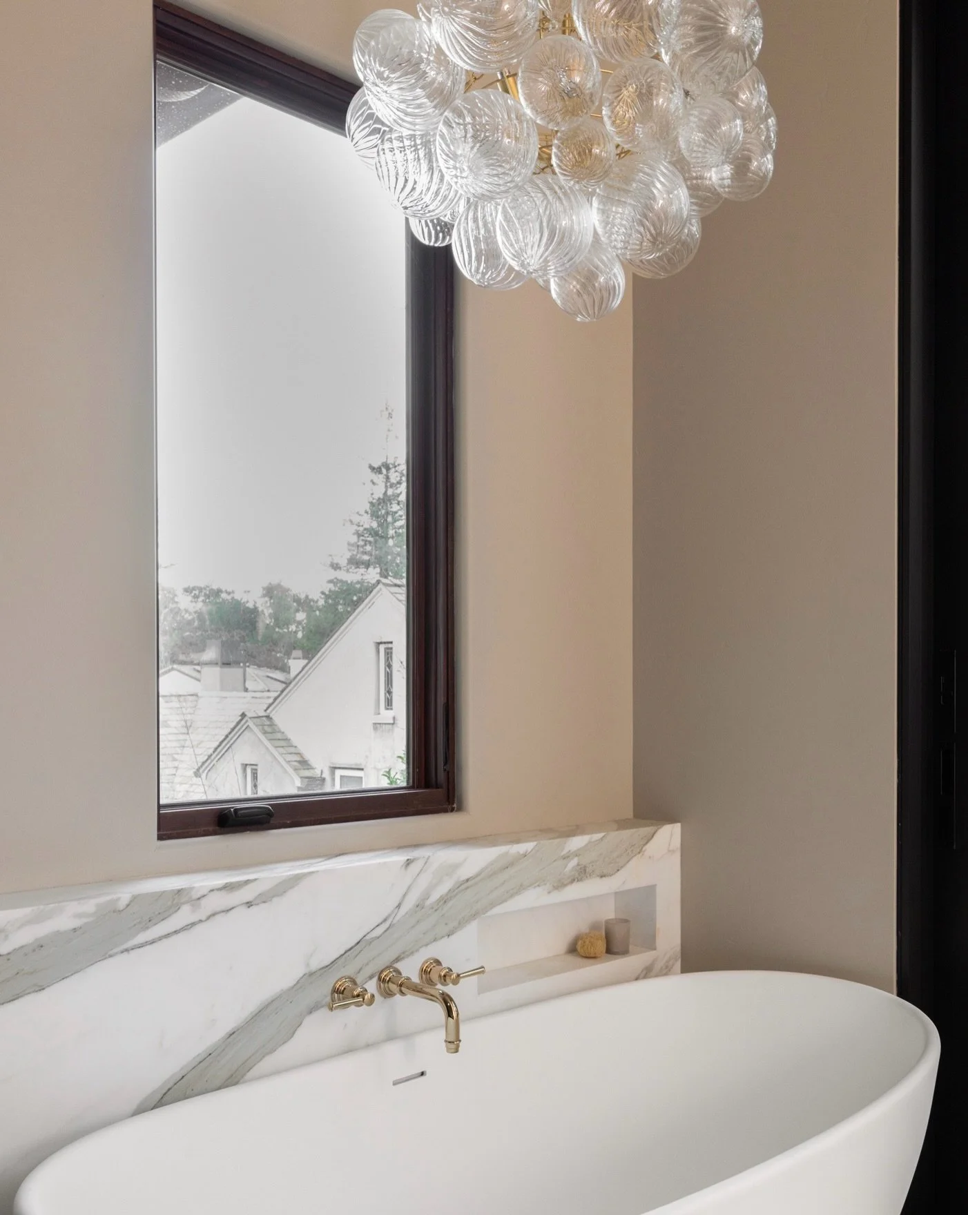 What you don&rsquo;t see at first glance is what makes this space even more special. &darr;

This project included a full addition, creating a seamless indoor-outdoor flow from the primary suite. Complete with a private deck, outdoor shower, and Japa