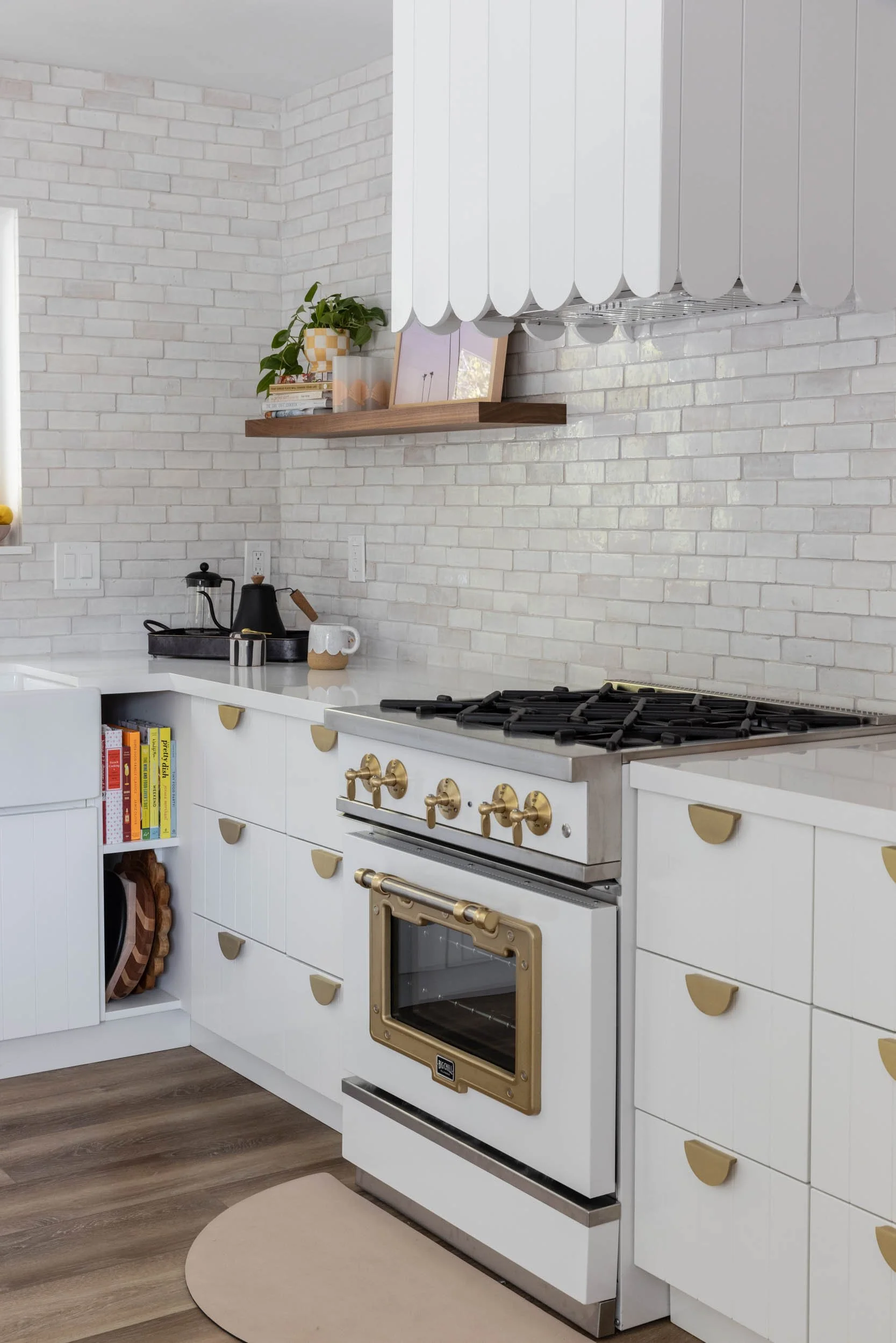 Kitchen storage nook, floating shelf, range, and custom range hood