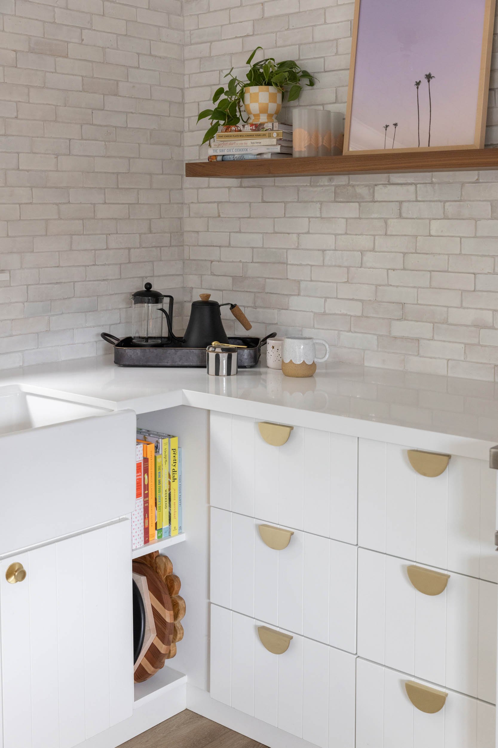 Kitchen island with storage nook and floating shelf