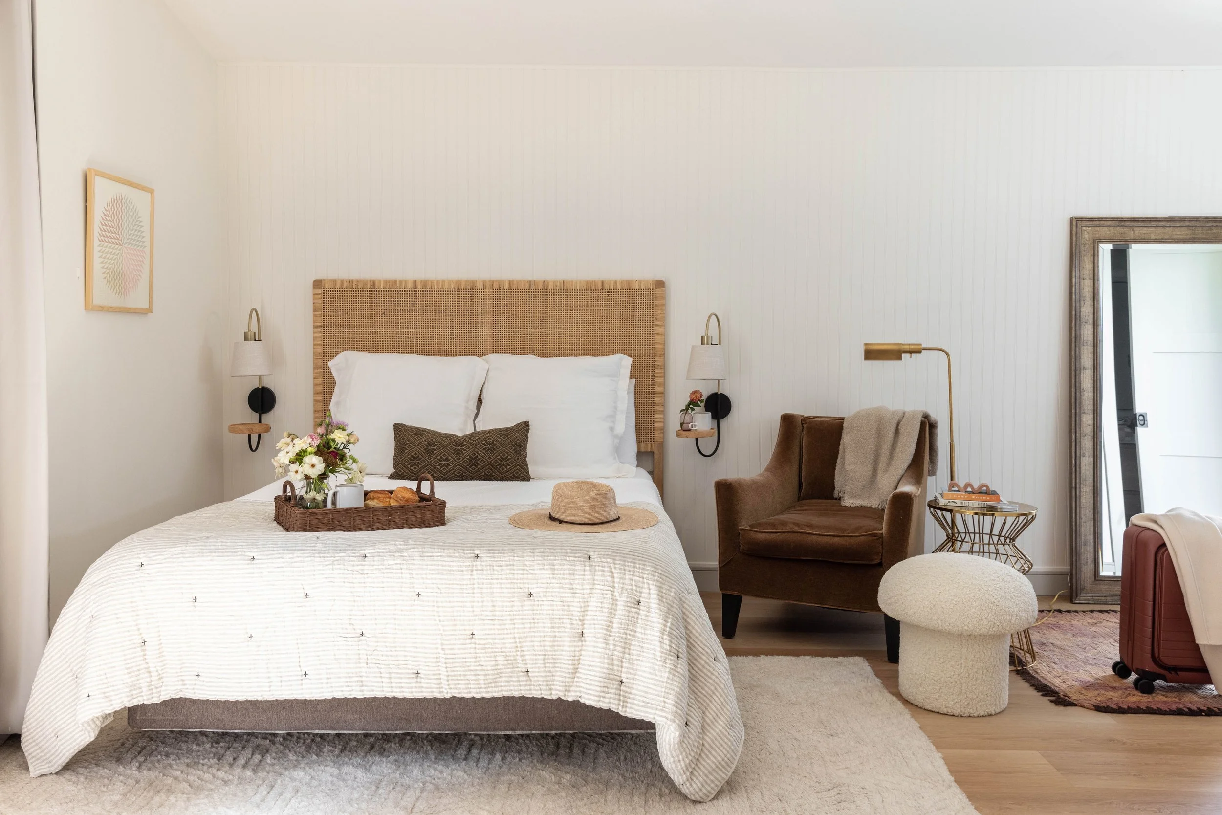 Bed with basket weave headboard, accent chair and standing mirror