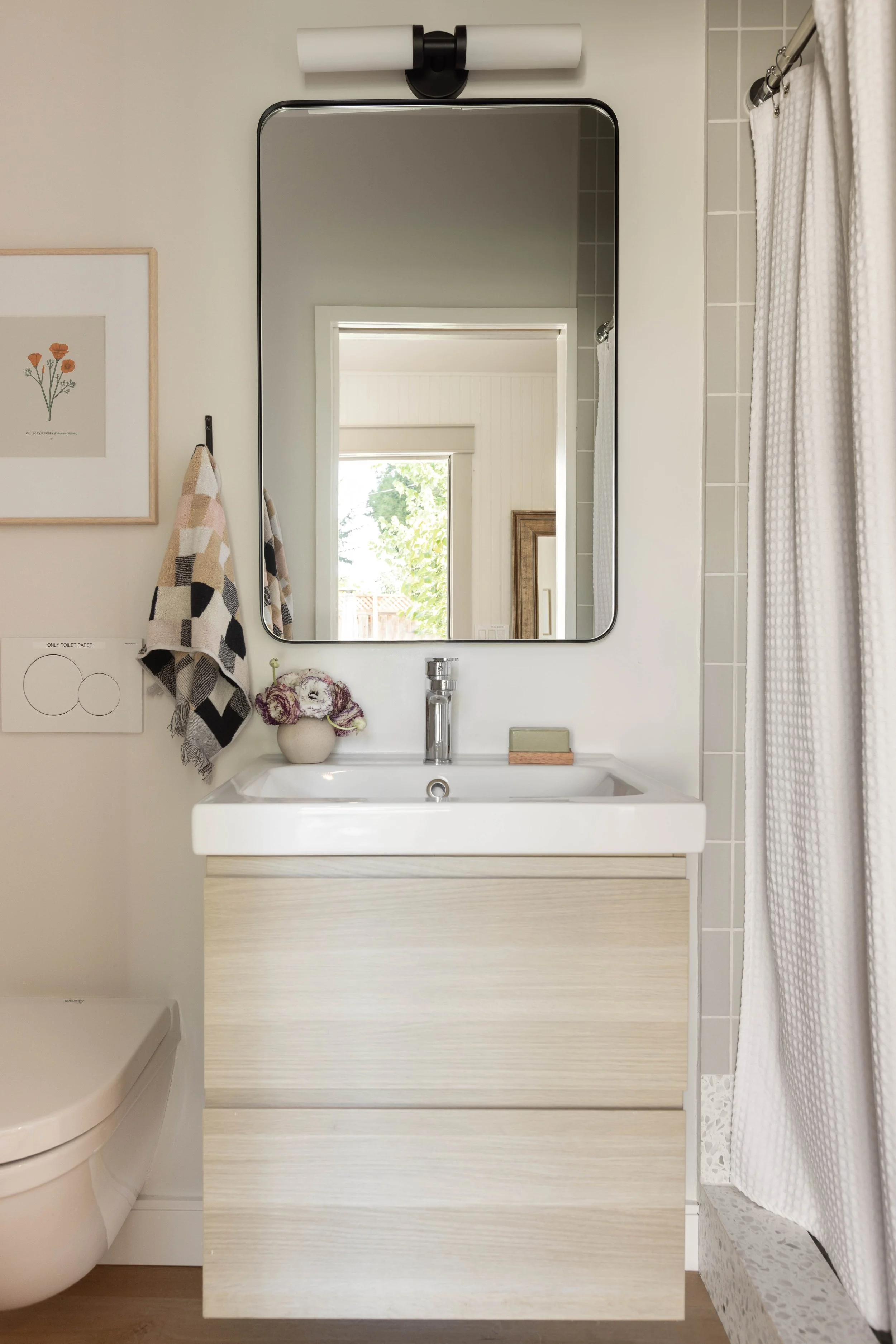Bathroom vanity, floating shelf, mirror and light fixture