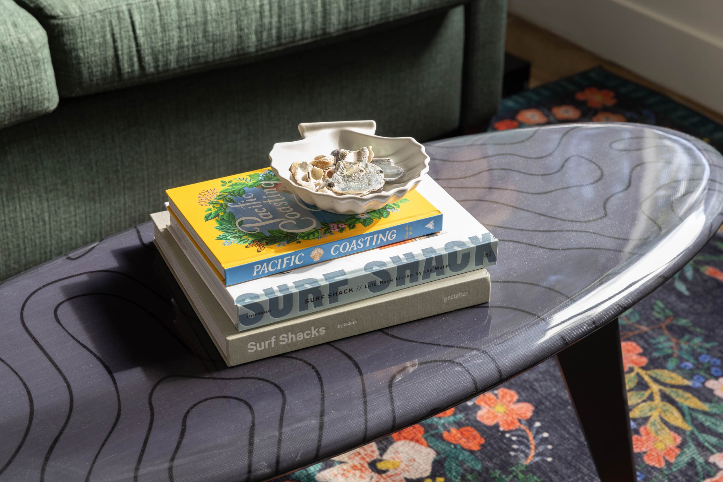 Coffee table with floral area rug