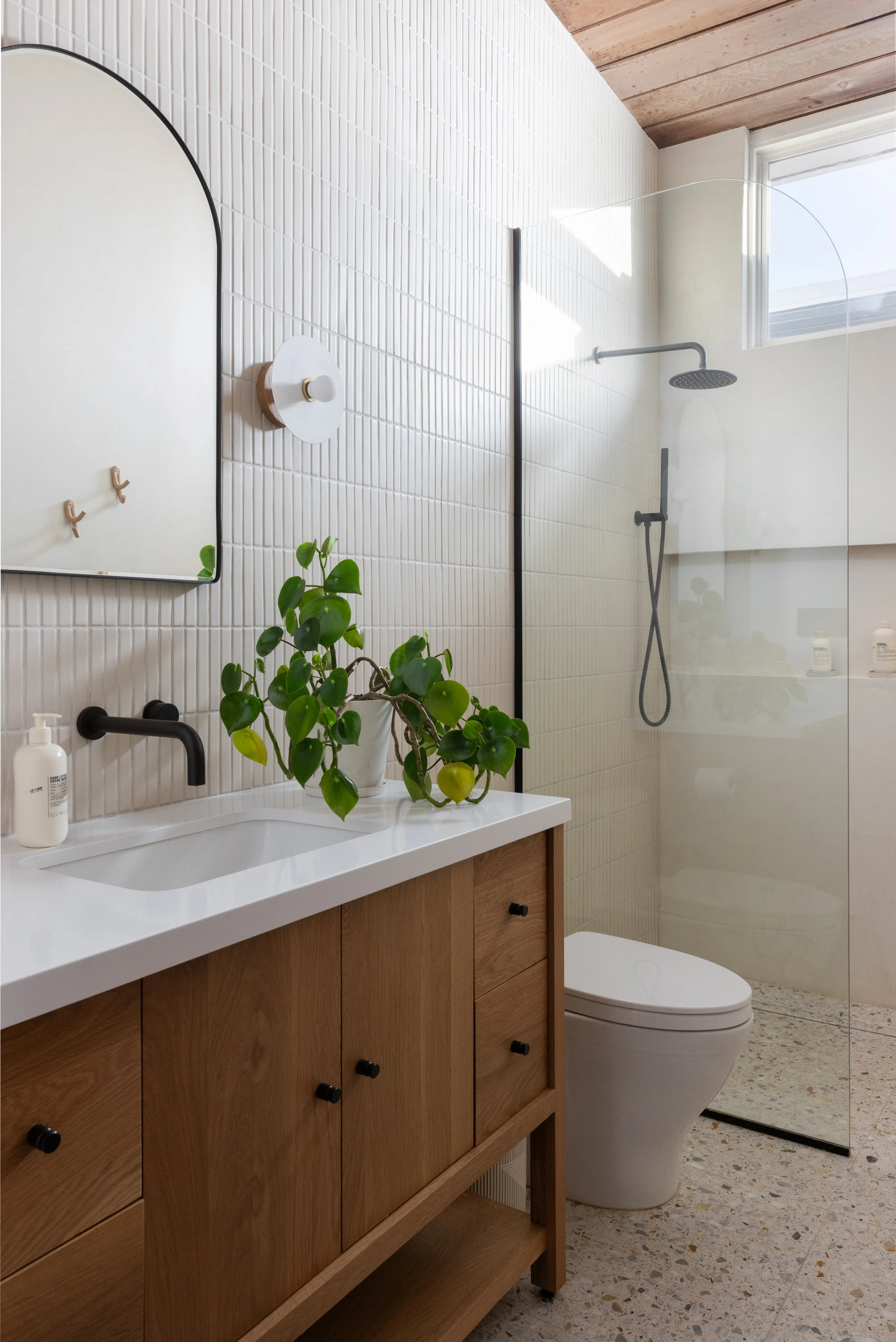Bathroom side profile with vanity, light fixture and mirror
