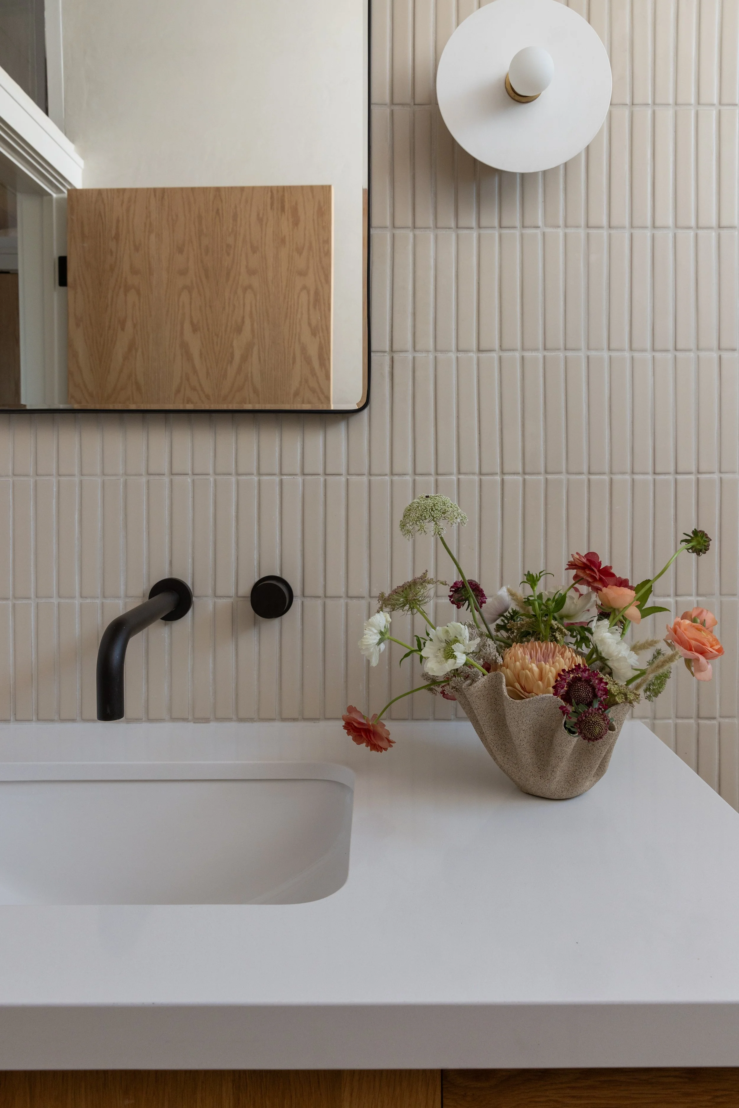 Bathroom tile, sink, light fixture and mirror