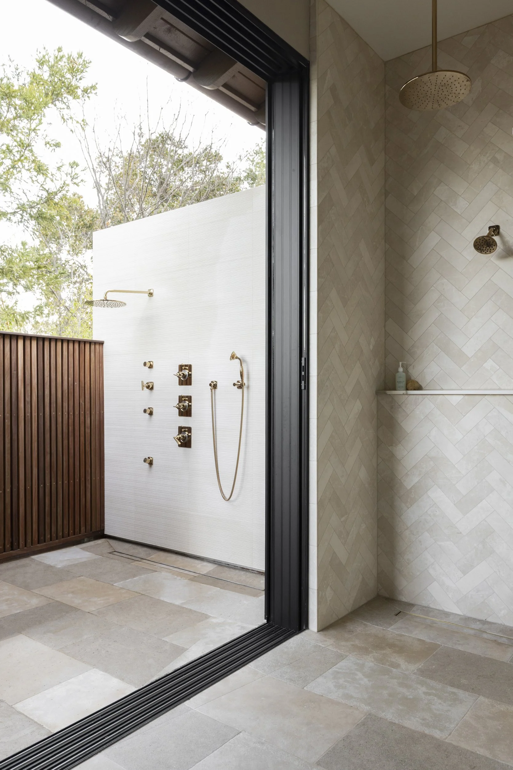 Outdoor shower with sliding glass doors