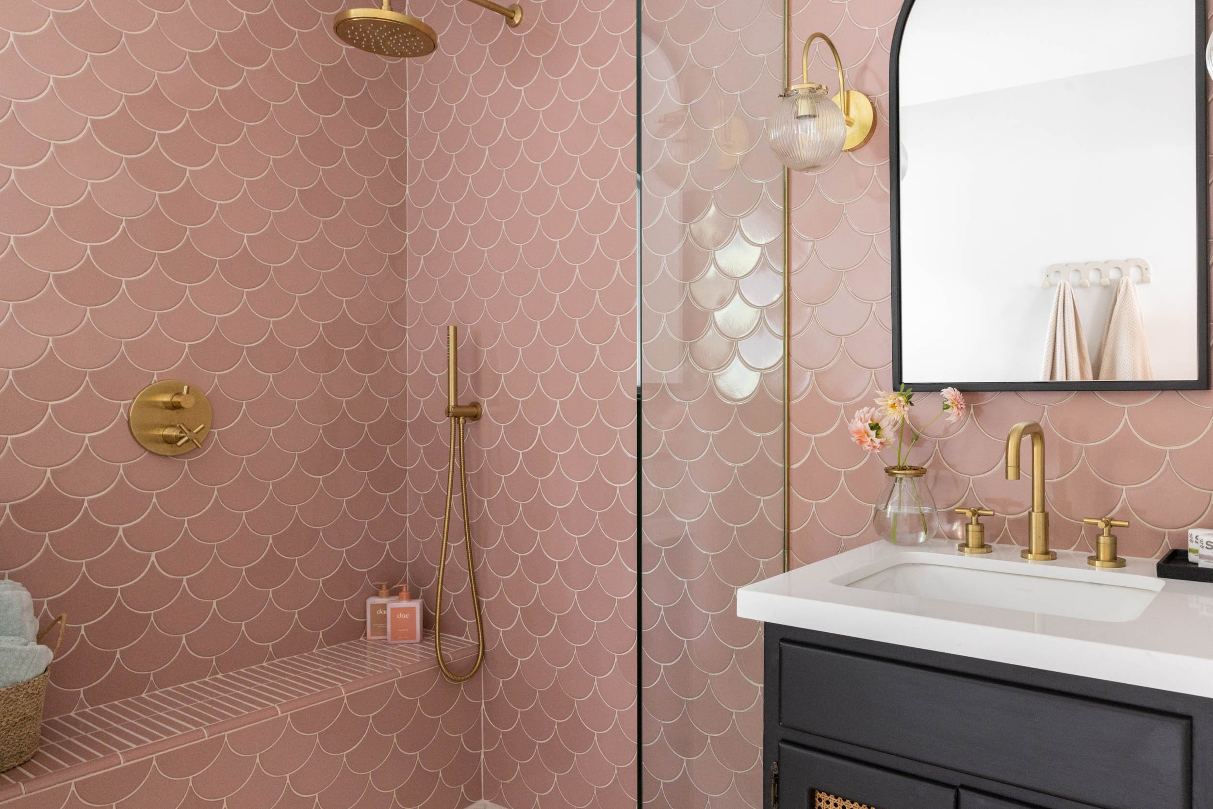 Pink Tessa tile ADA compliant shower with vanity, mirror and light fixture