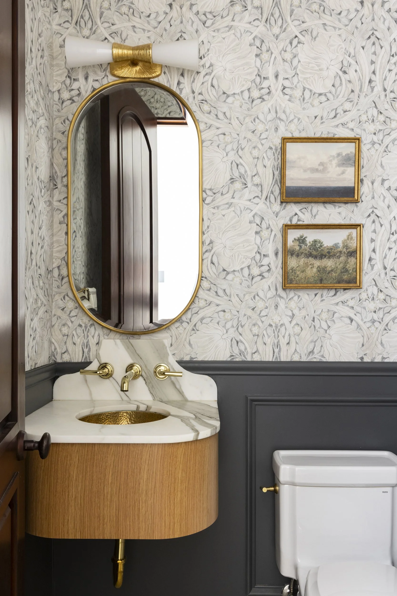 Powder bathroom with vanity, mirror and light fixture