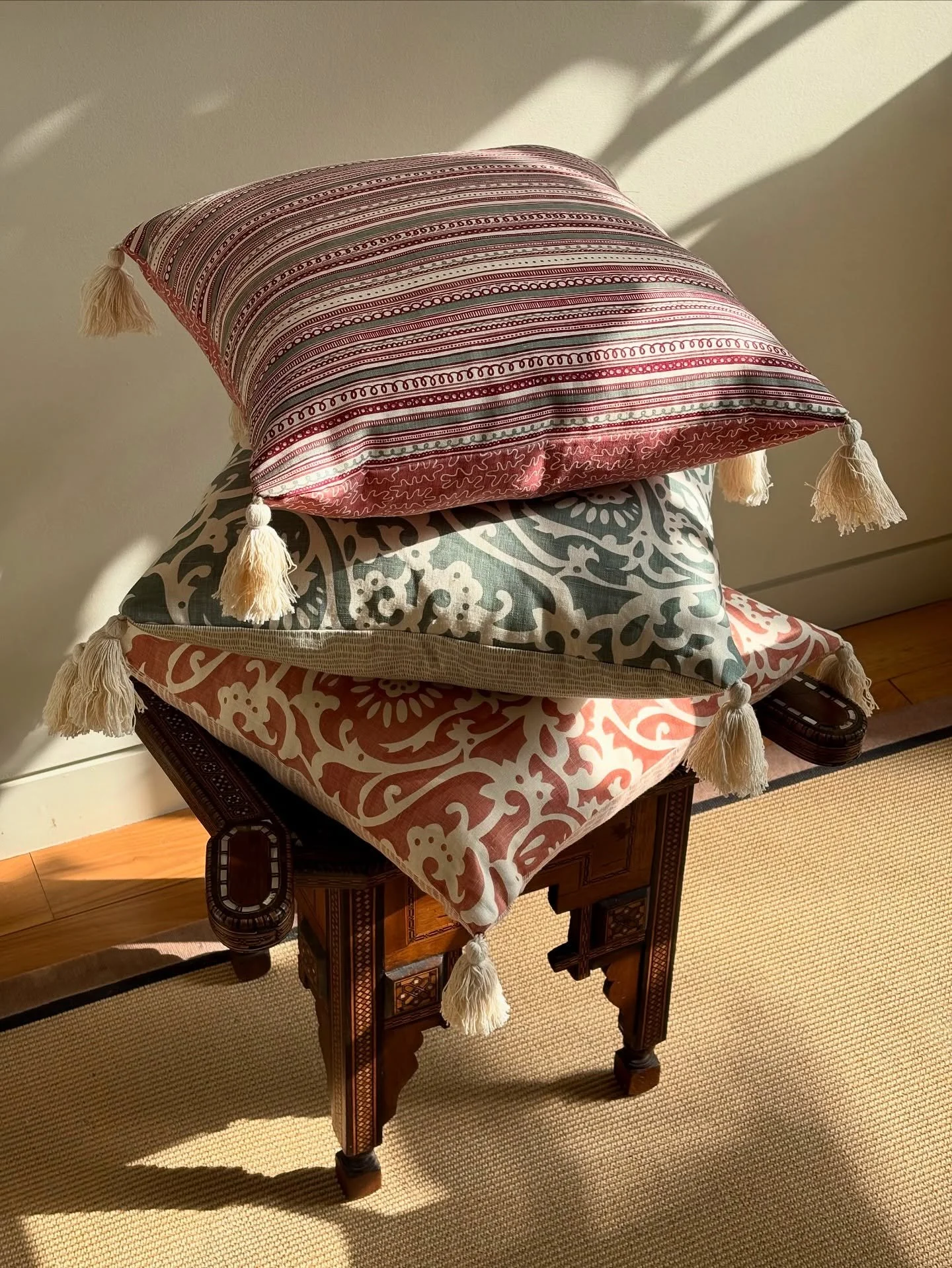 A cushion trilogy, by Charlotte Peters Designs. For really high tables. Or &lsquo;Princess and the Pea&rsquo; bottoms.