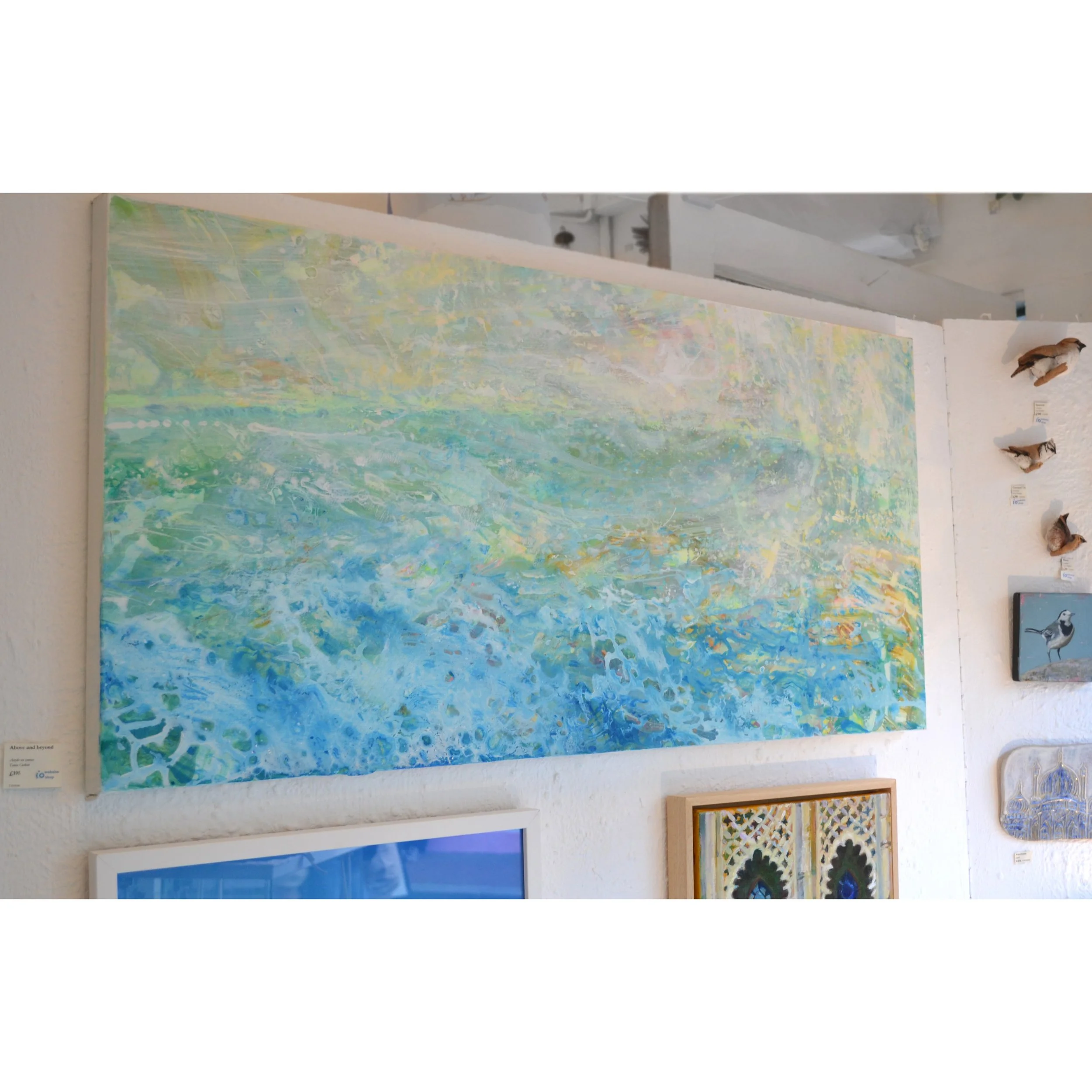 above and beyond on wall.JPG