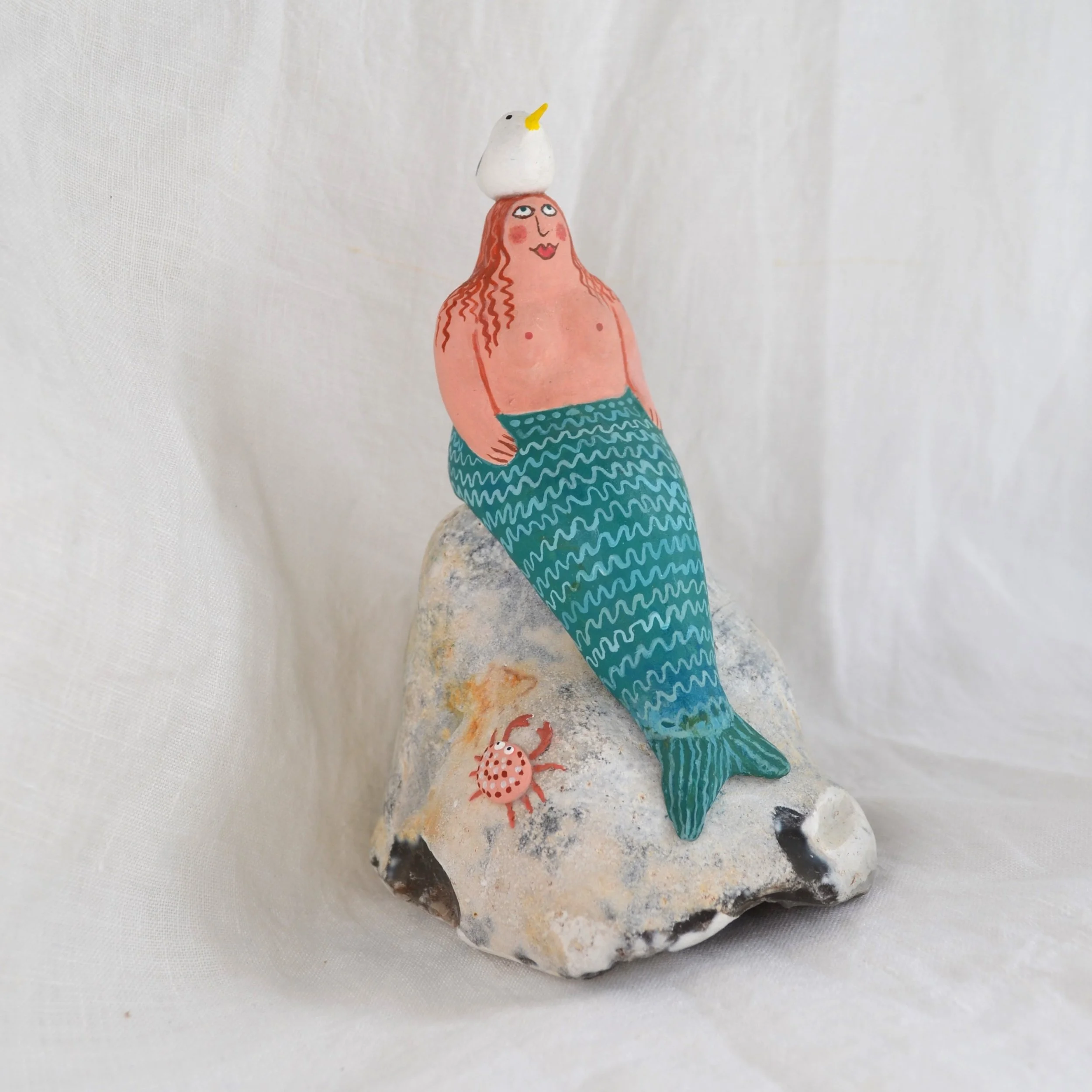 Mermaid on rock with seagull