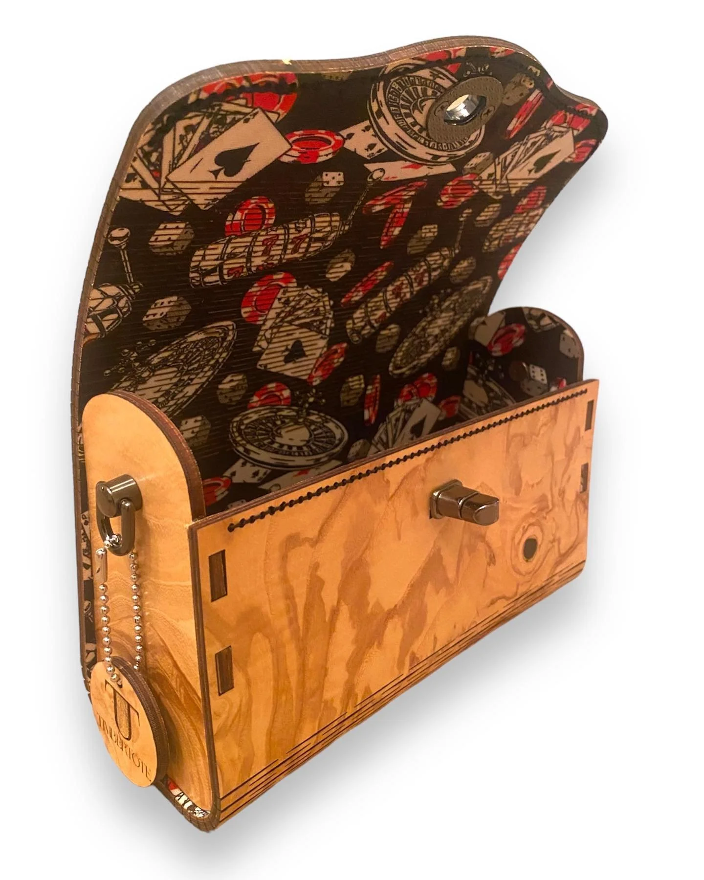 Photo of a TimberTote with a wood frame and interior lined with fabric depicting poker cards, dice and other Las Vegas gambling paraphernalia