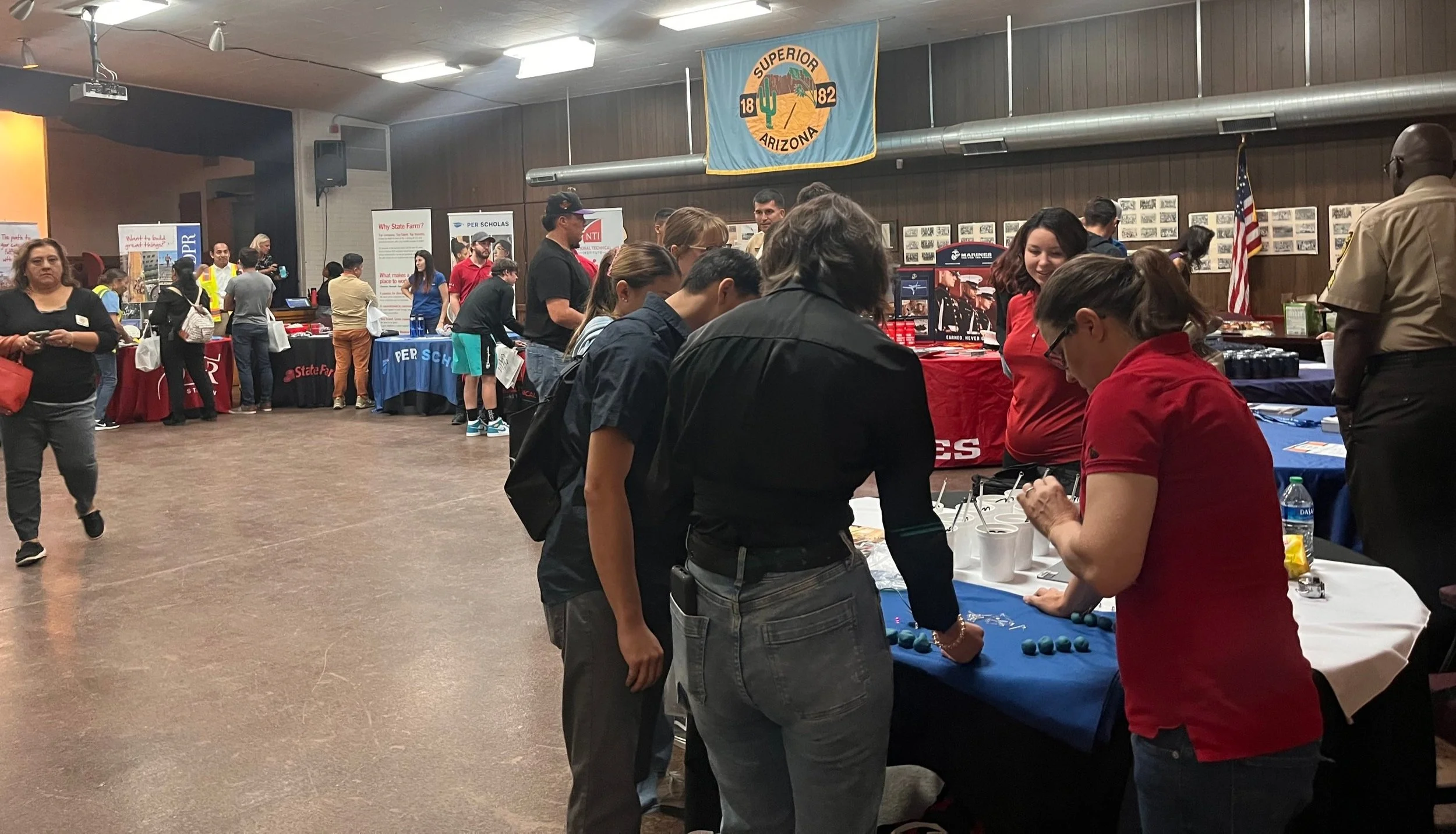 Photo of job seekers visiting tables at Superior career fair