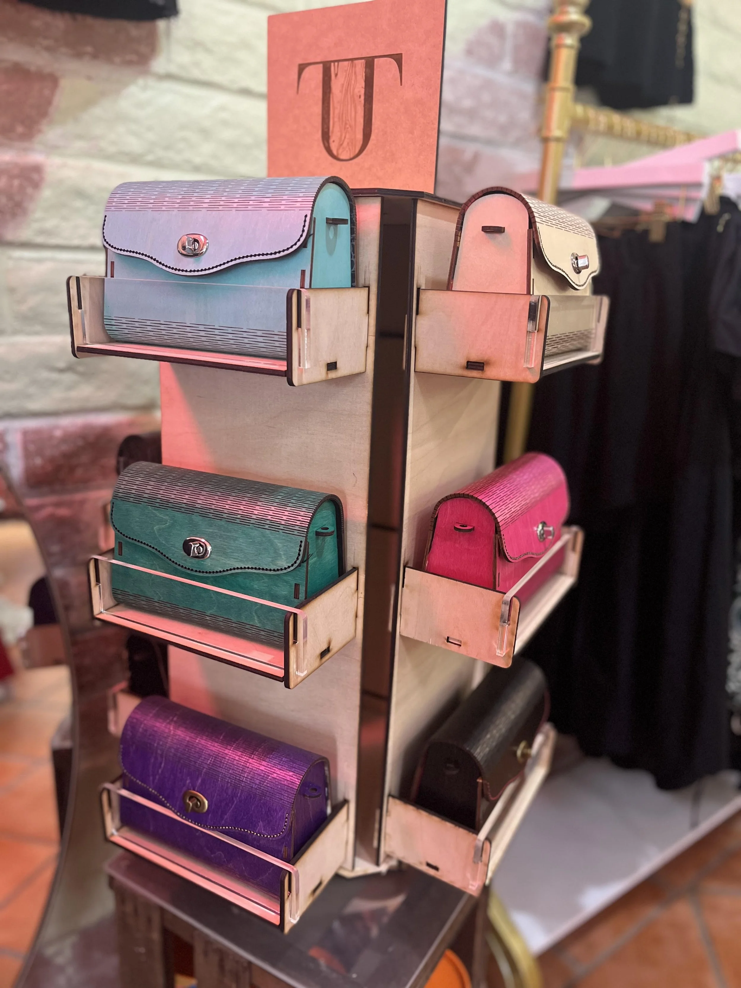Photo of a display case in a retail shop with different styles of TimberTotes elegantly on show