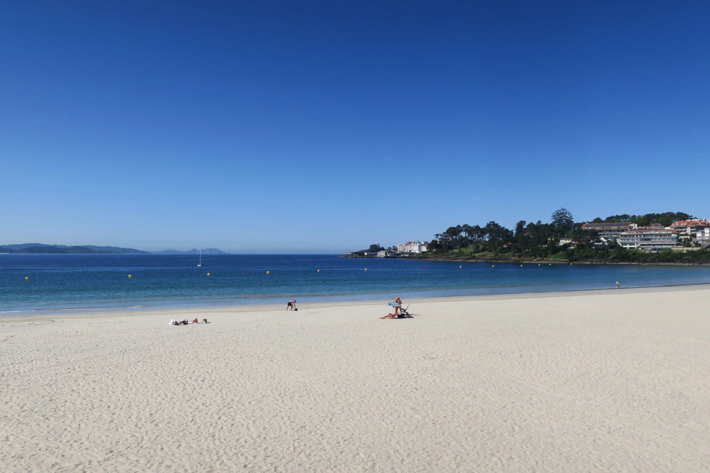 White sandy beach, blue sea, on the Rías Baixas coastline