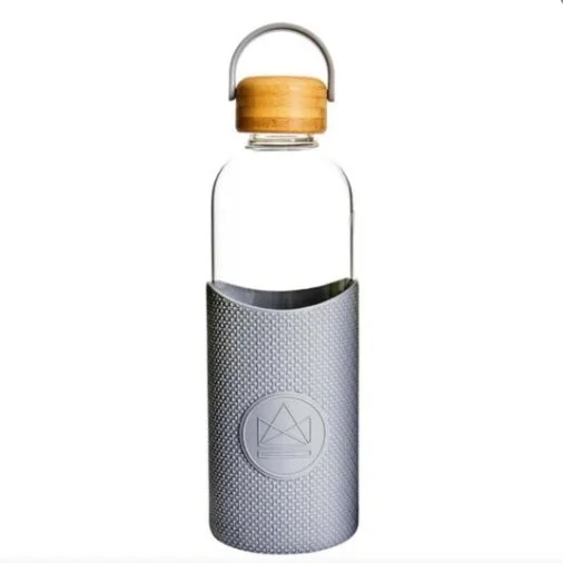 Glass water bottle with grey silicone sleeve and bamboo lid