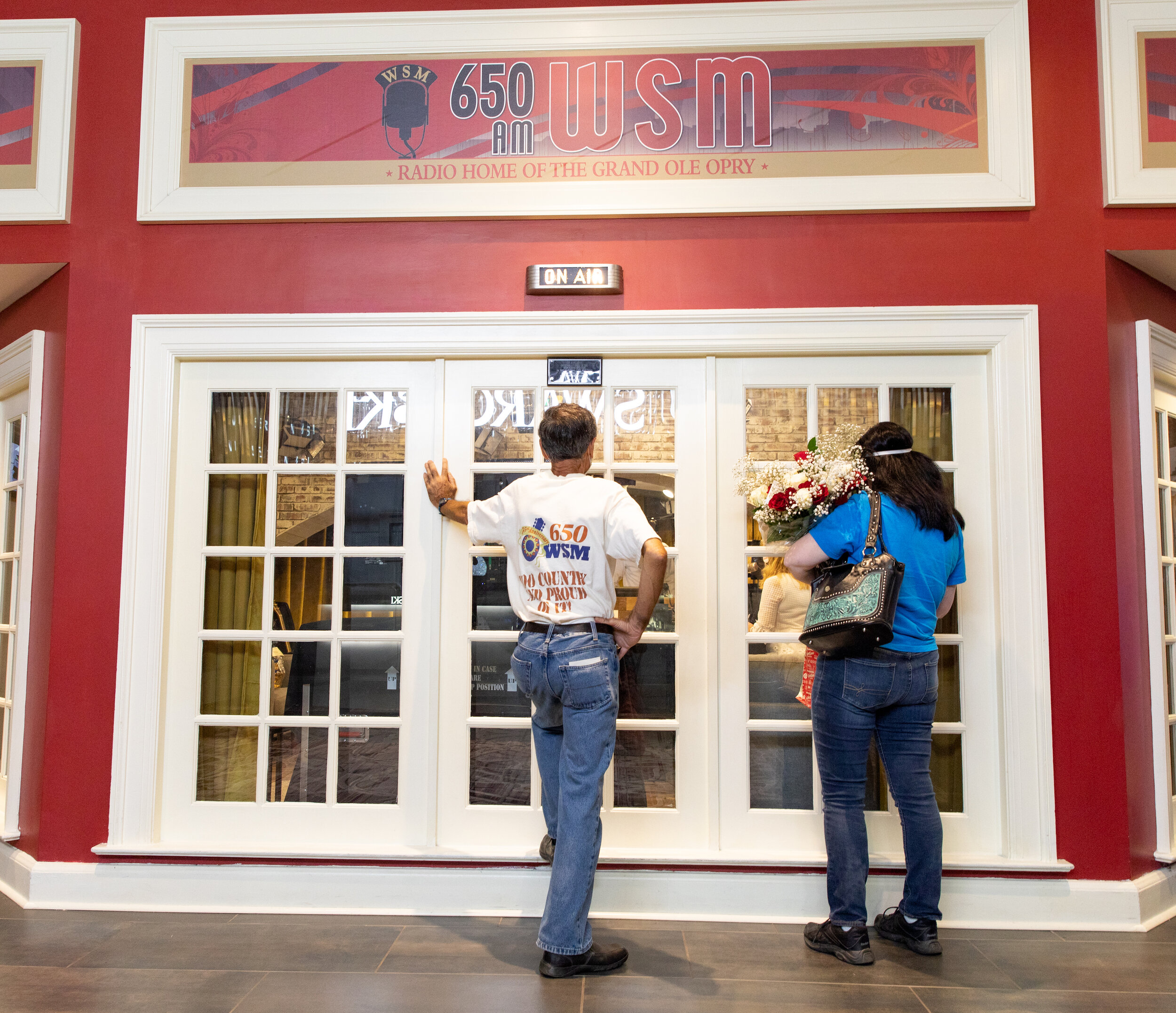  Fans gather outside the booth inside the Opryland Hotel to catch a glimpse of The Eddie Stubbs show one last time. 