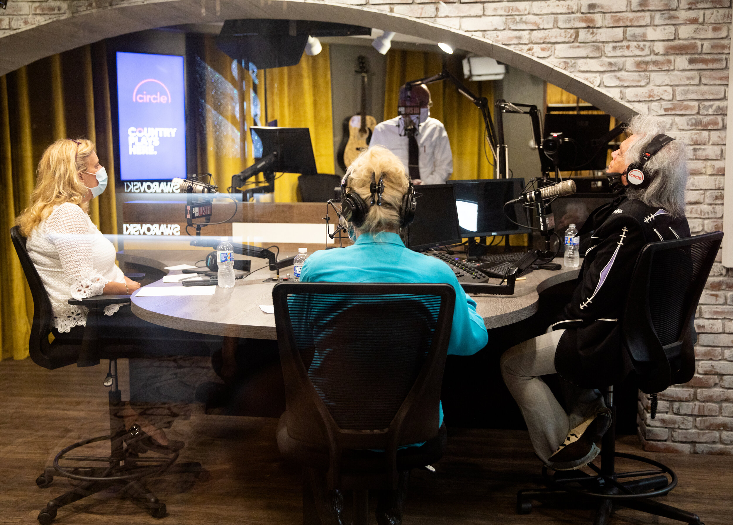  Marty Stuart and Connie Smith intently listening to a Kitty Wells record during the broadcast. 