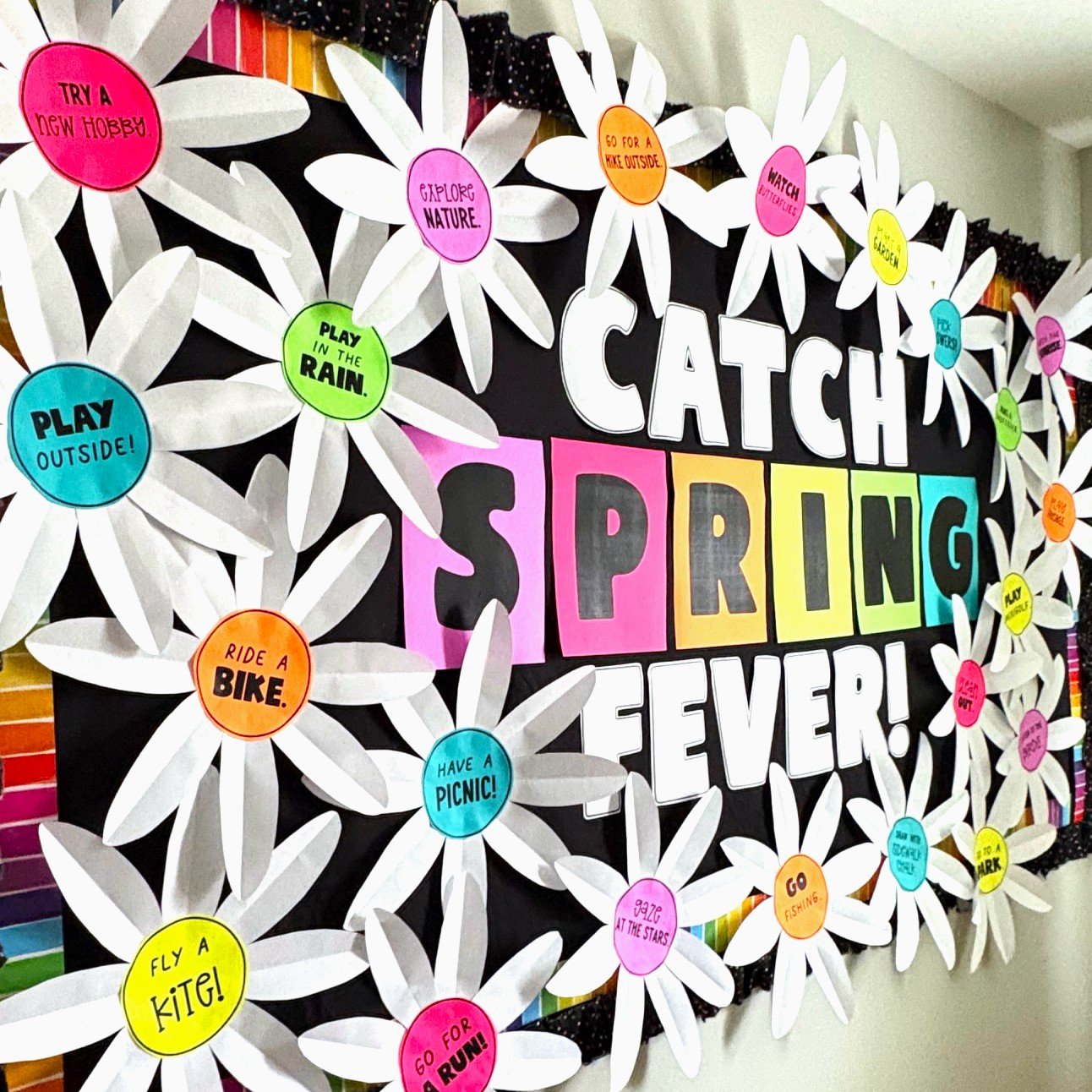spring bulletin board with paper flowers