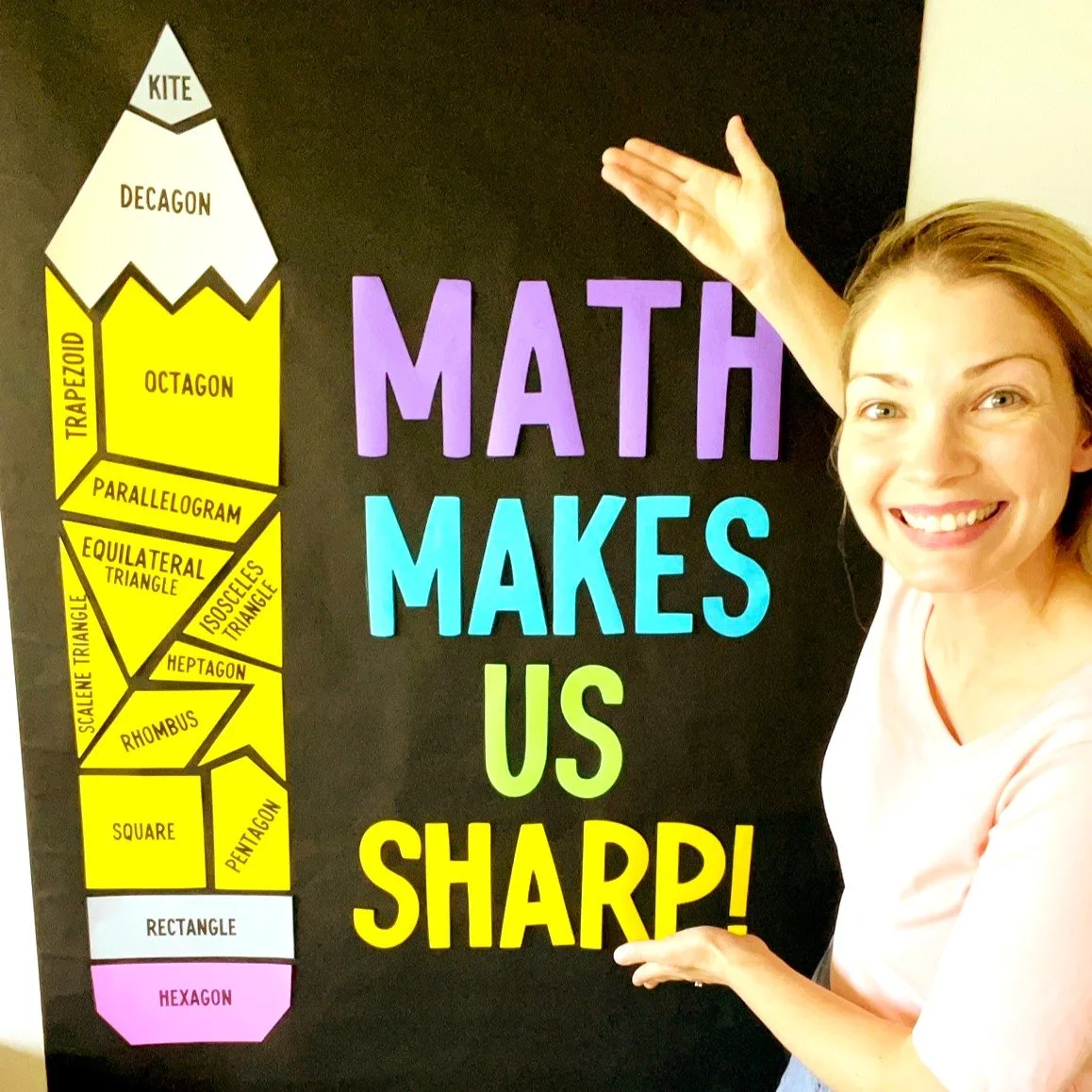 classroom decoration with a pencil made of polygons that says, "Math makes us sharp!"