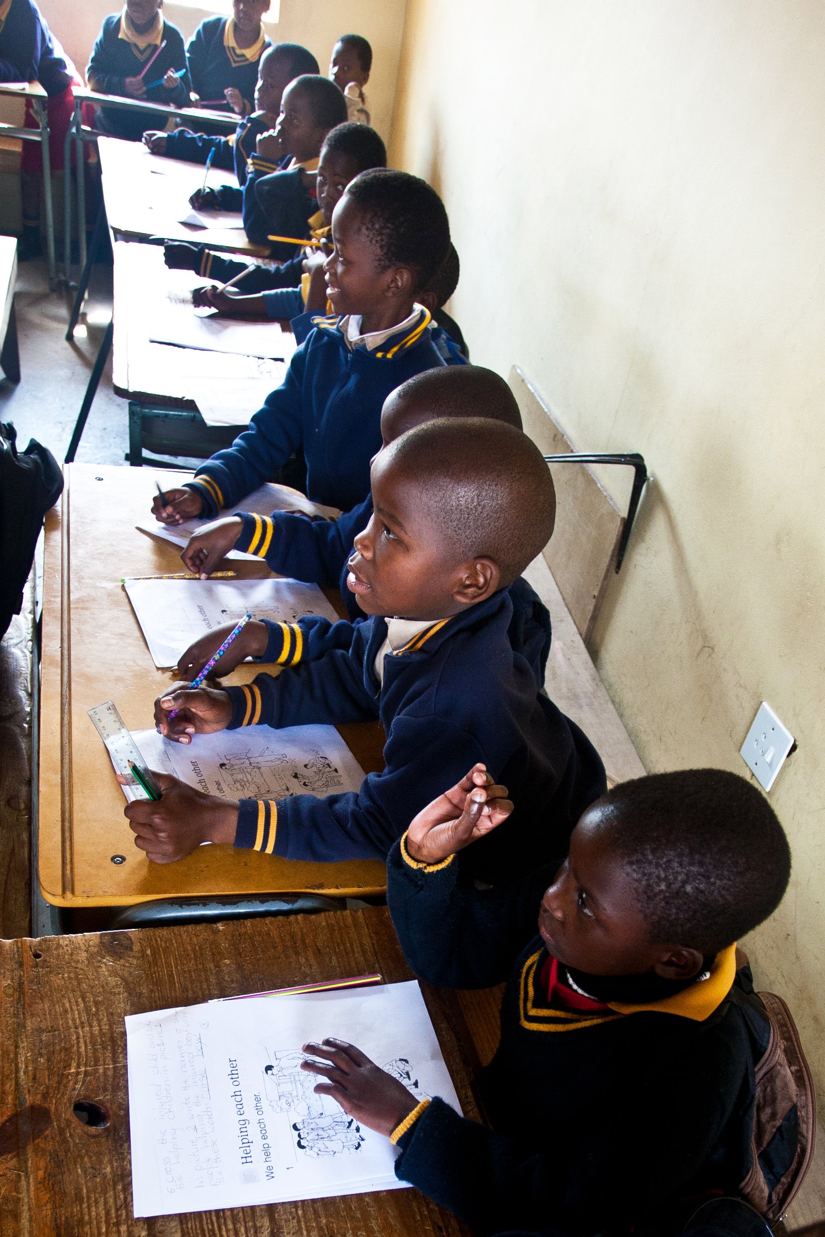 vertical image of children in class.jpg