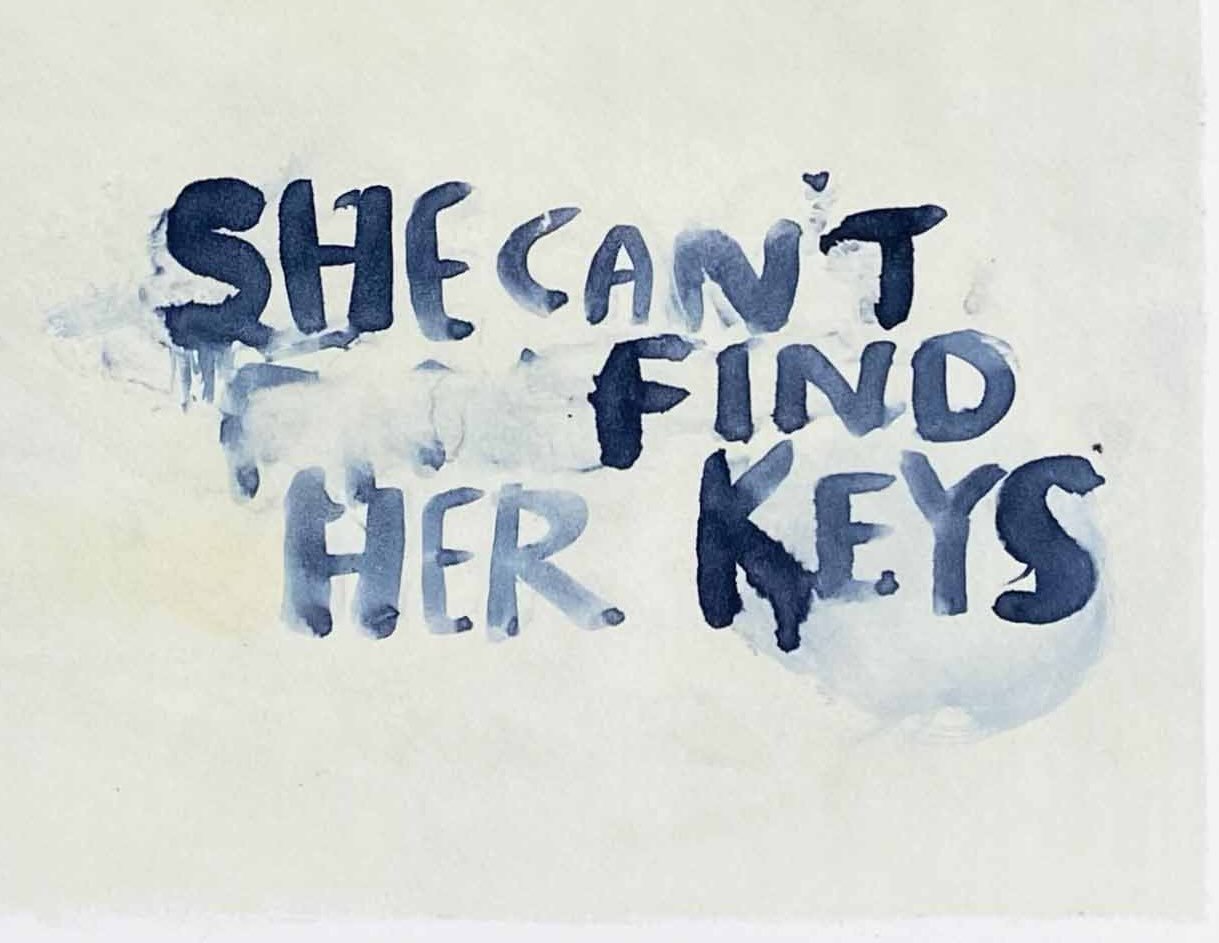Hand-painted blue text reading “SHE CAN’T FIND HER KEYS.”