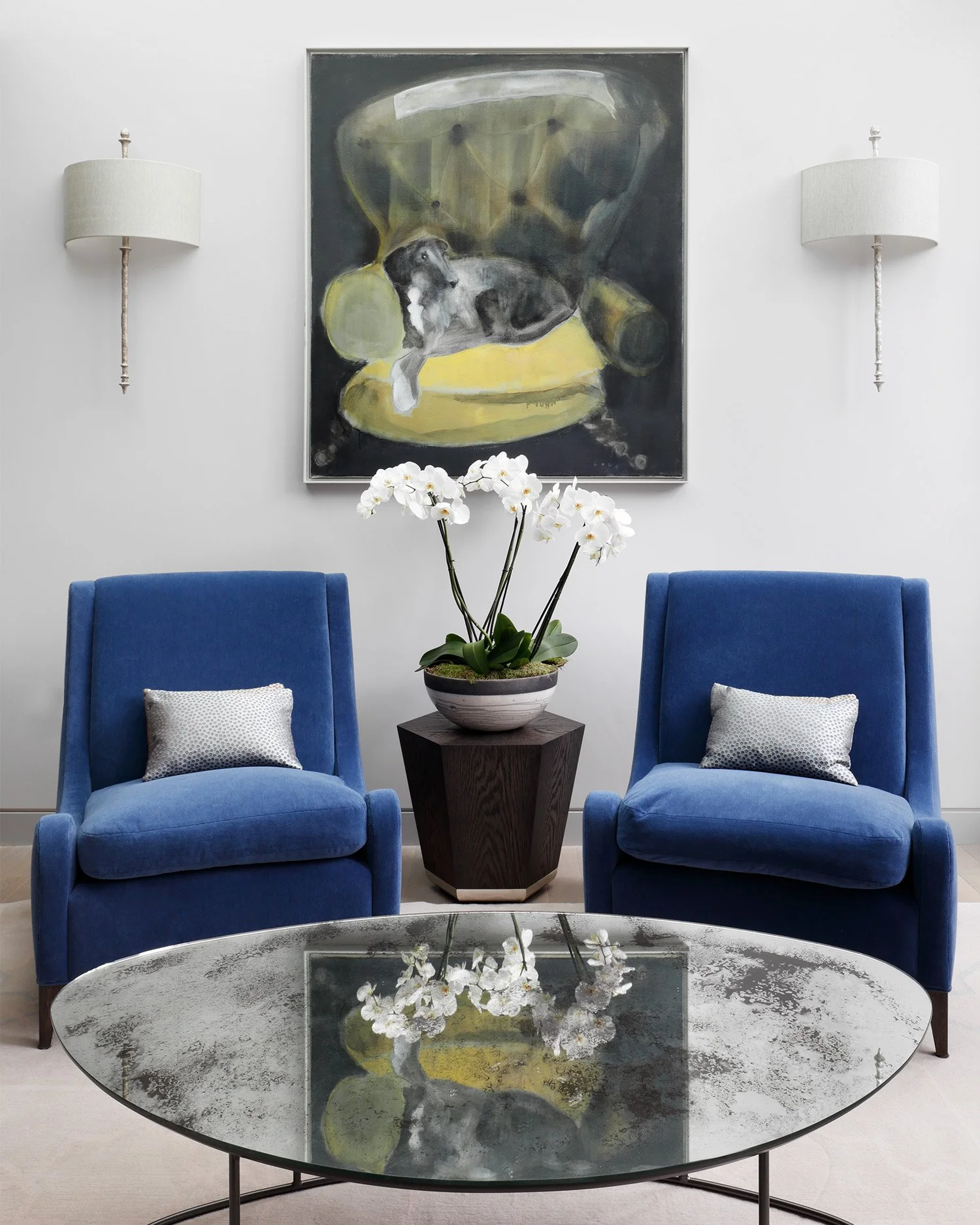 This table is a bespoke design by WOOLF, it has an acid etched mirror piece with a rolled steel frame, that pairs with these deco arm chairs in luxurious mohair blue. We wanted to create this area to give a harmonious, relaxing and meaningful space f