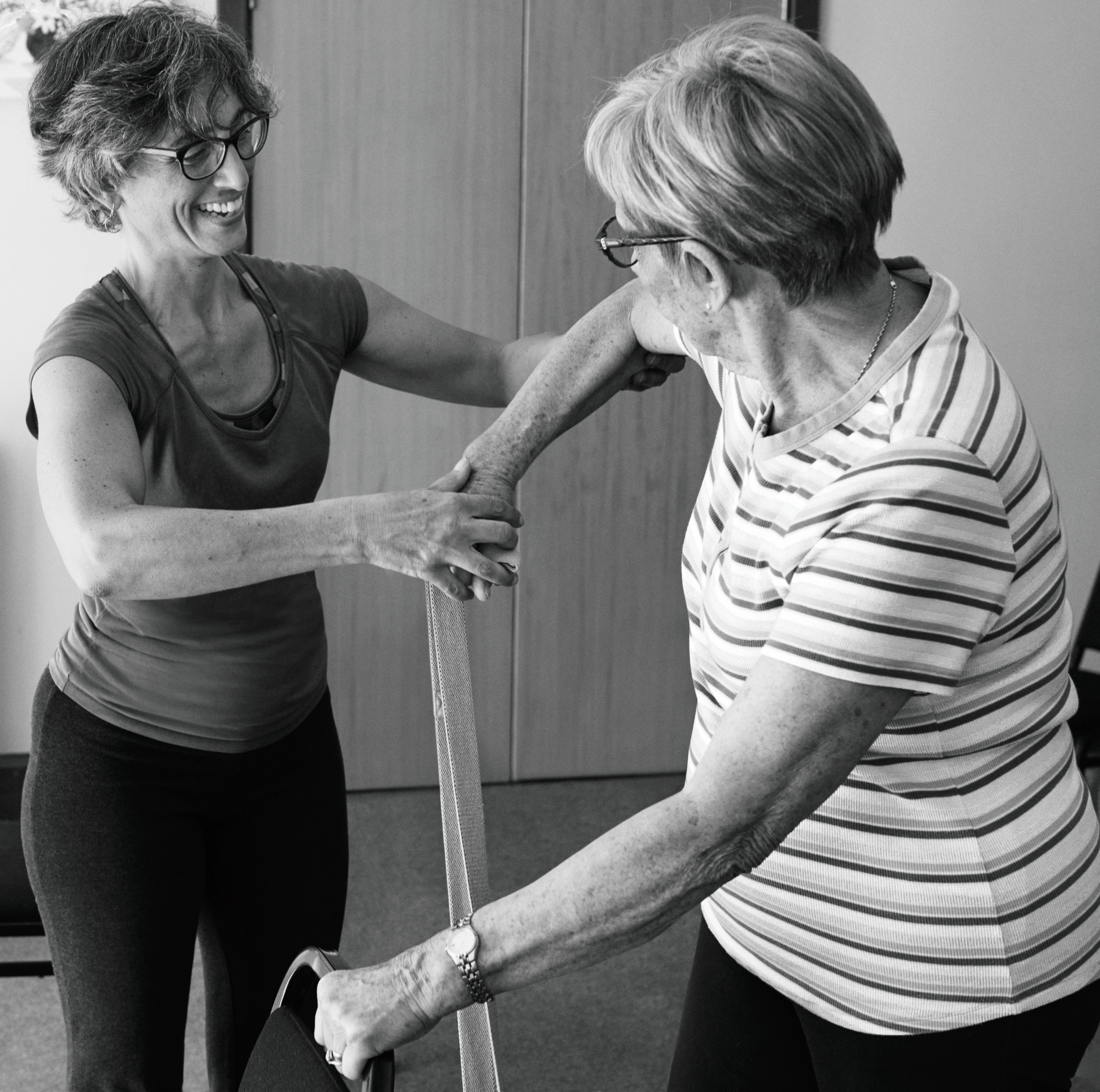 Yoga teacher and student in a private lesson
