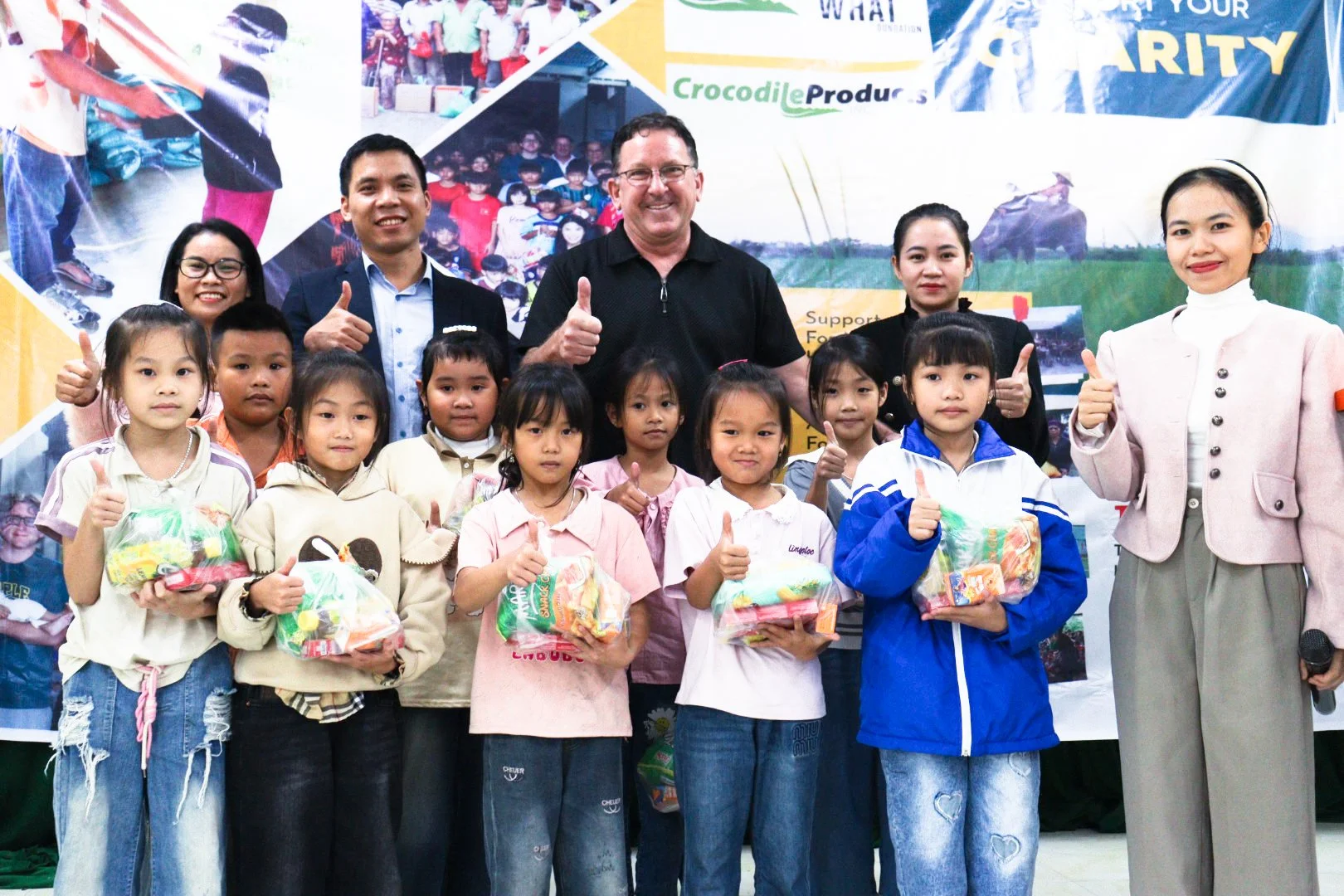 DONATED 100 LARGE GIFT PACKAGES TO 100 POOR FAMILIES IN PHU LE COMMUNE AND DISTRIBUTED 200 PACKAGES OF SWEETS AND SNACKS TO STUDENTS IN REMOTE AREAS