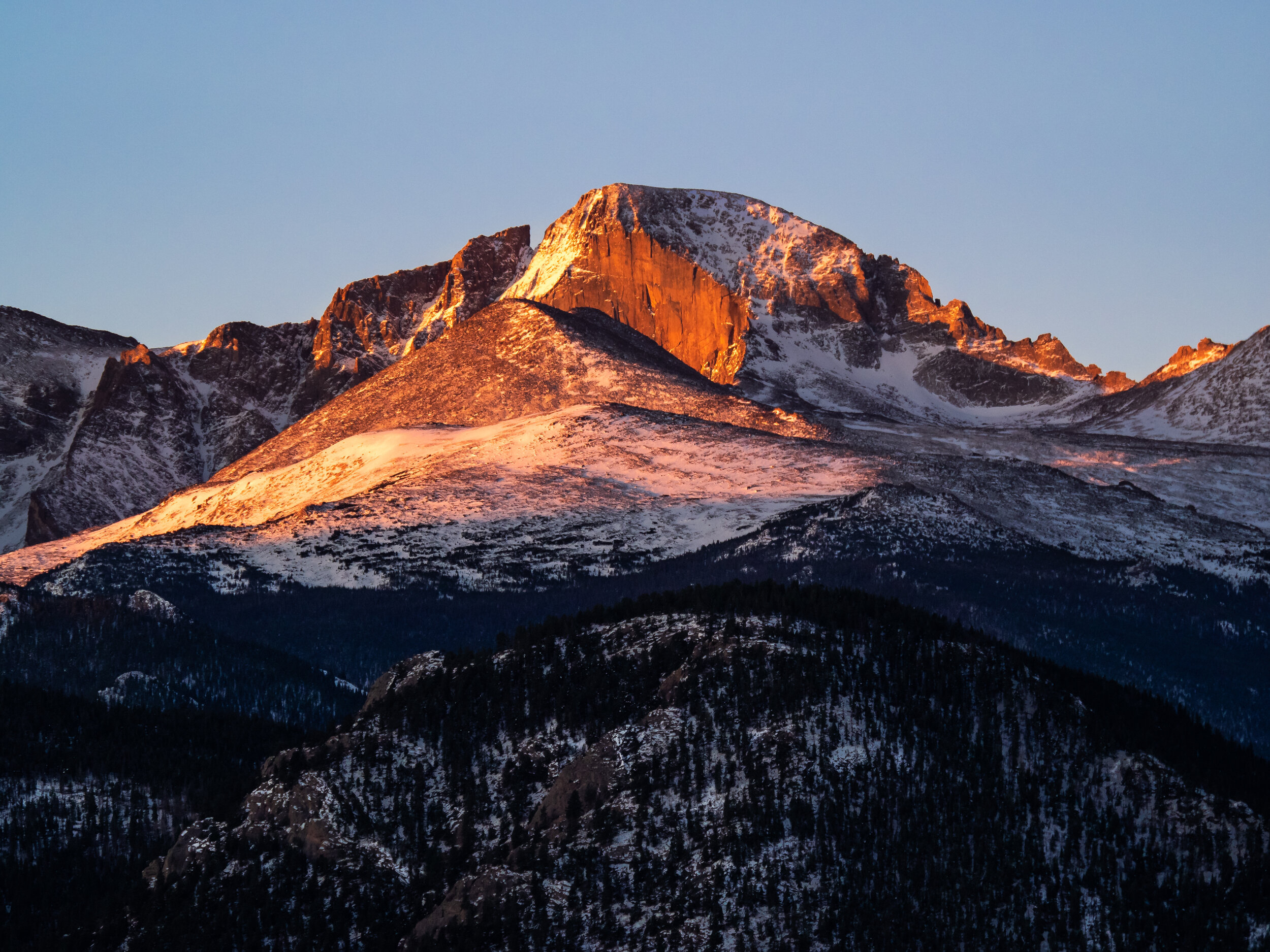 Longs Peak in the first rays of morning and with a light dusting of snow