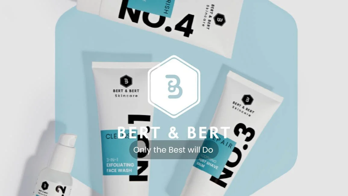 Collection of Bert & Bert skincare products, including exfoliating face wash and post-shave balm, arranged on a light blue background with the brand's logo and slogan.