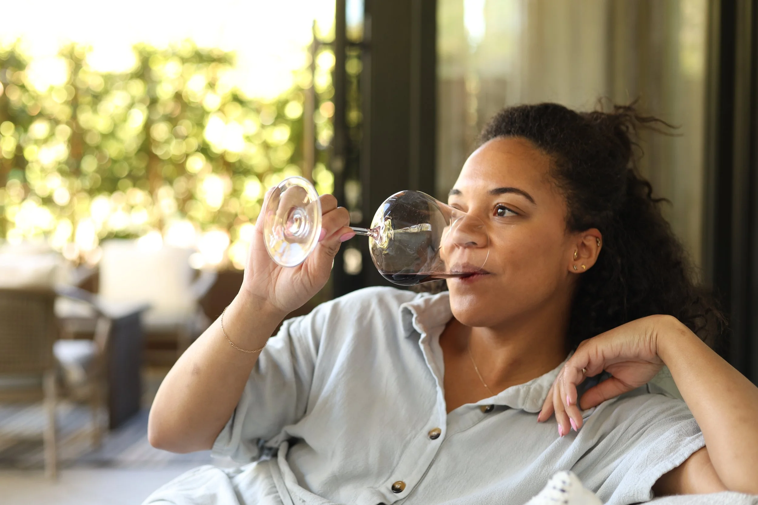 Lindsay Perry drinking a glass of wine