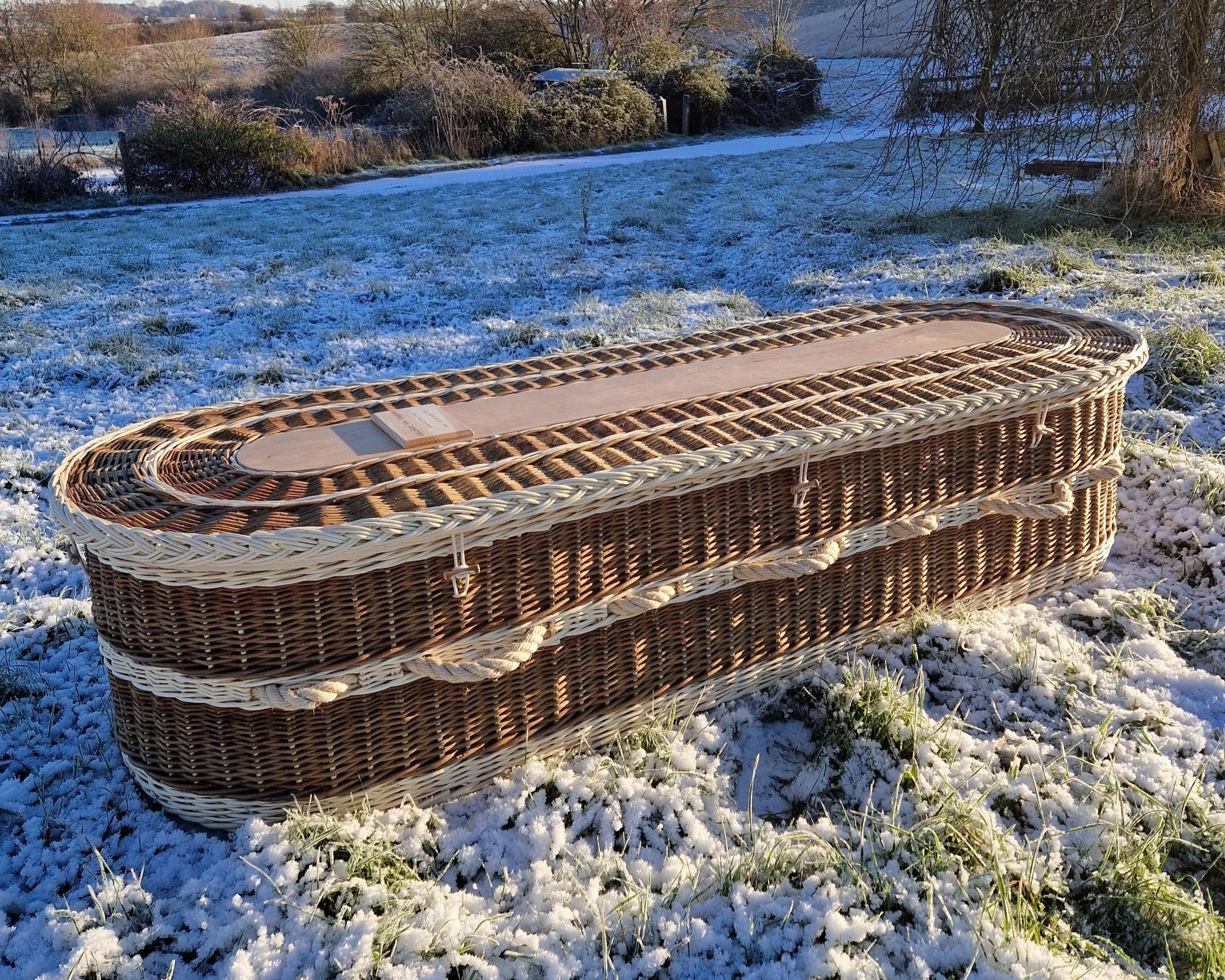 brown and white willow coffin