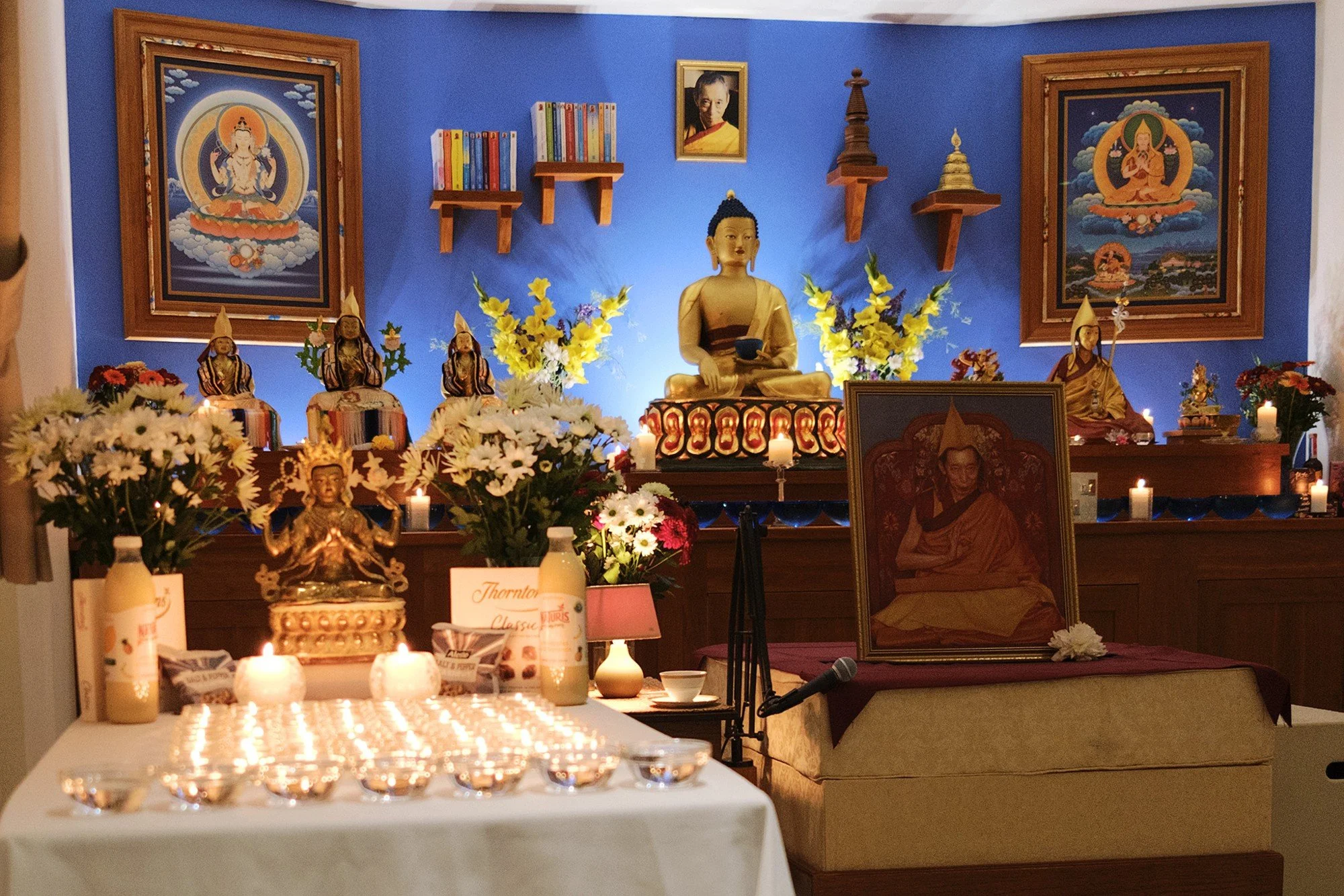 Candles and flowers before the shrine at Candlelight Prayers in 2023.