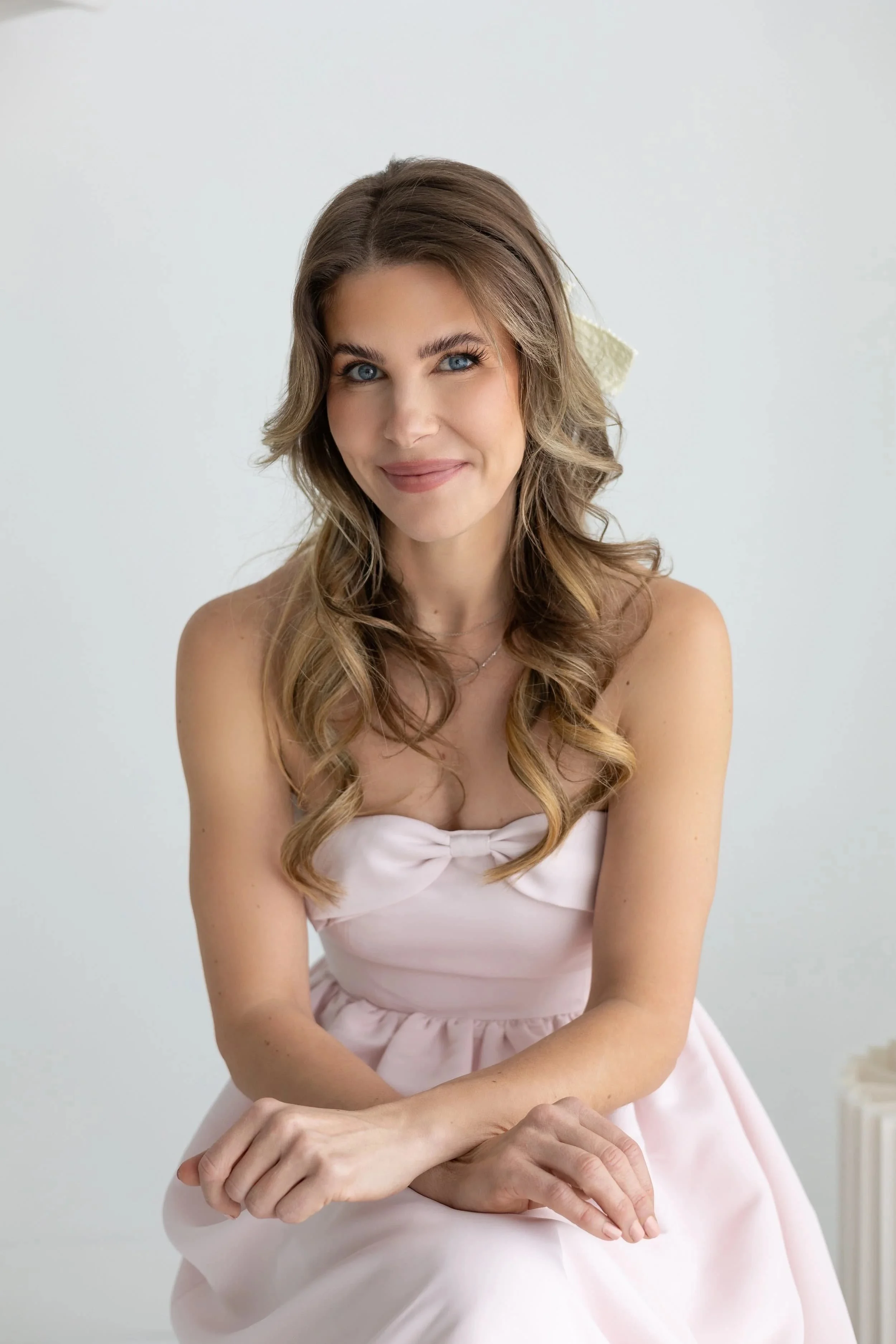 Professional headshot of Lauren Weber, child sleep consultant and sleep educator.