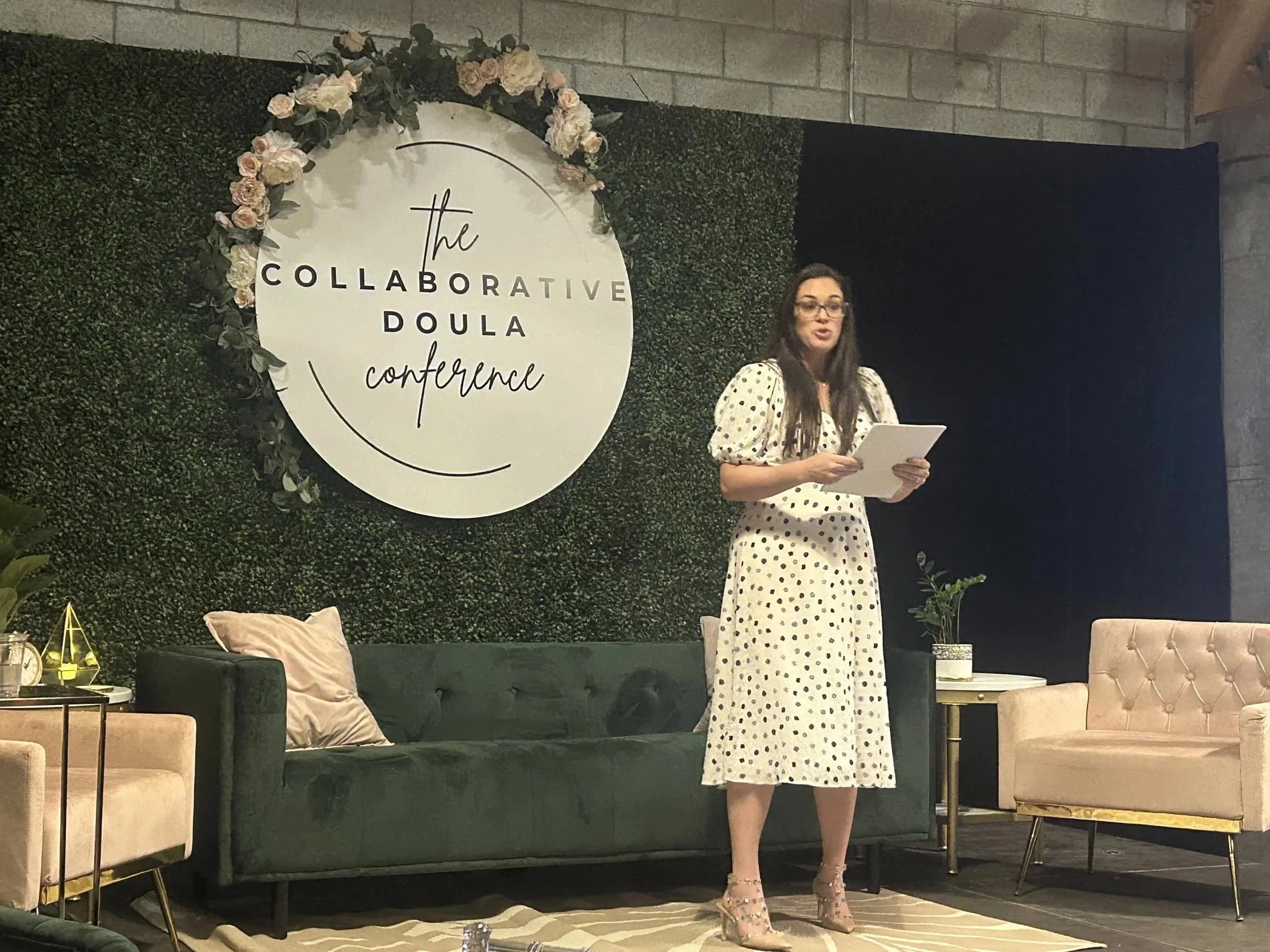 A woman speaks on fertility and surrogacy at The Collaborative Doula Conference in London, Ontario.