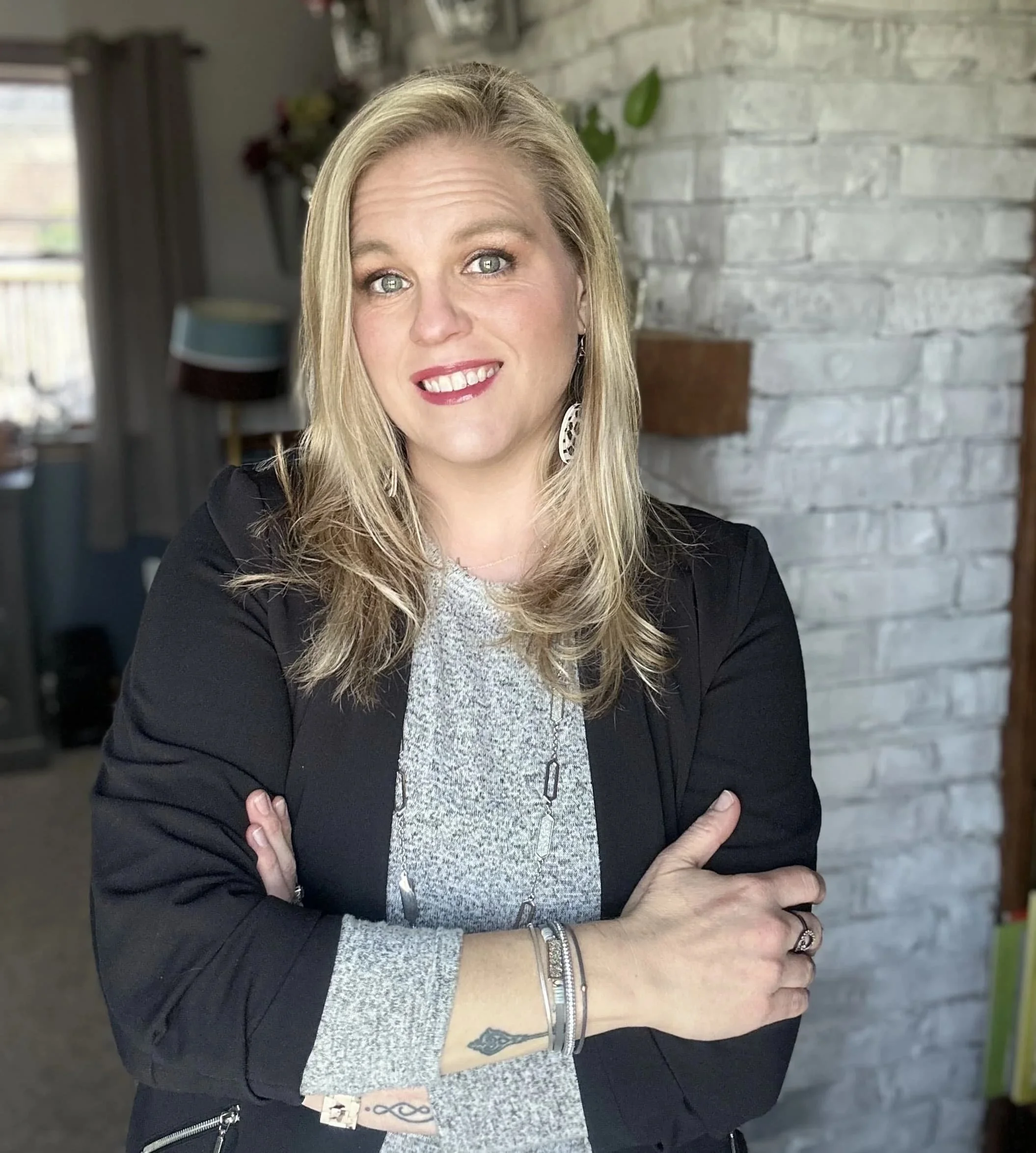 Professional headshot of Kacie, an RN, author, educator, and founder of Death Doula School.