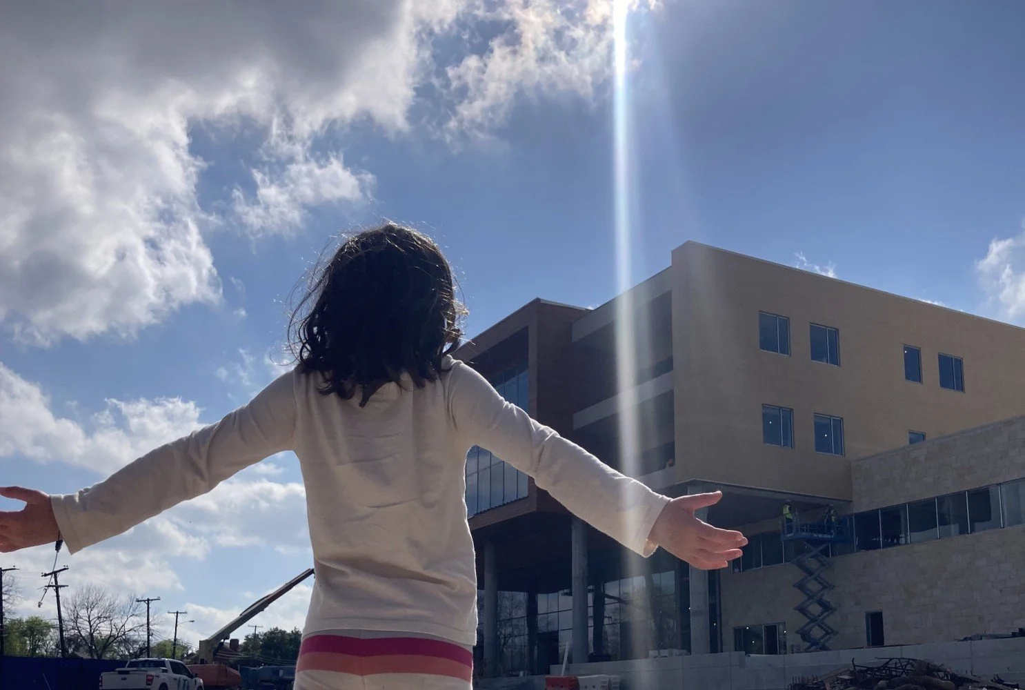 Daughter in front of family medicine clinic