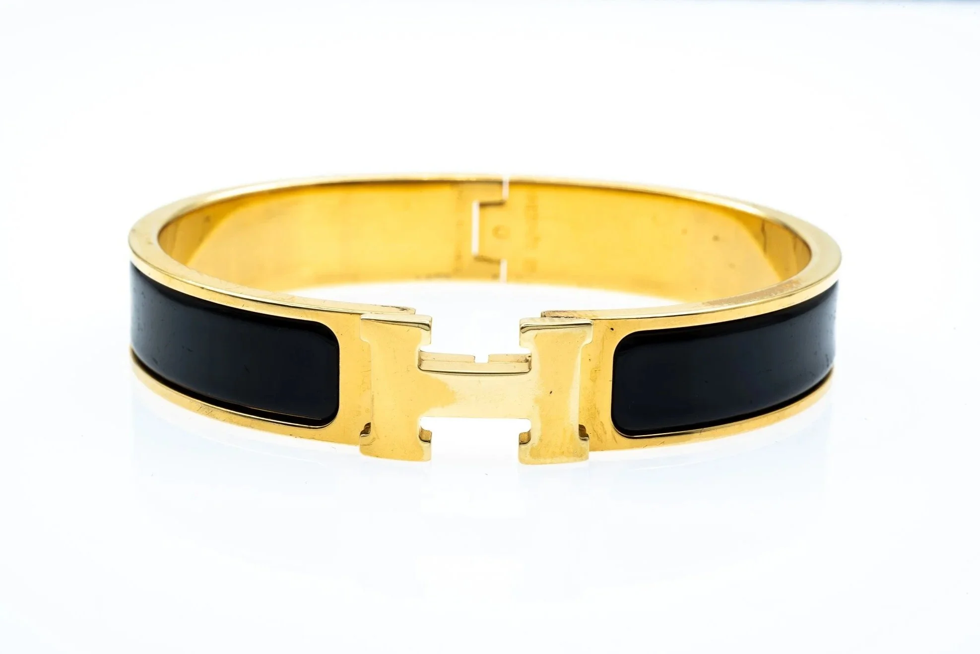 Gold Toned Black Enamel Hermes Clic H Hinged Bangle Bracelet