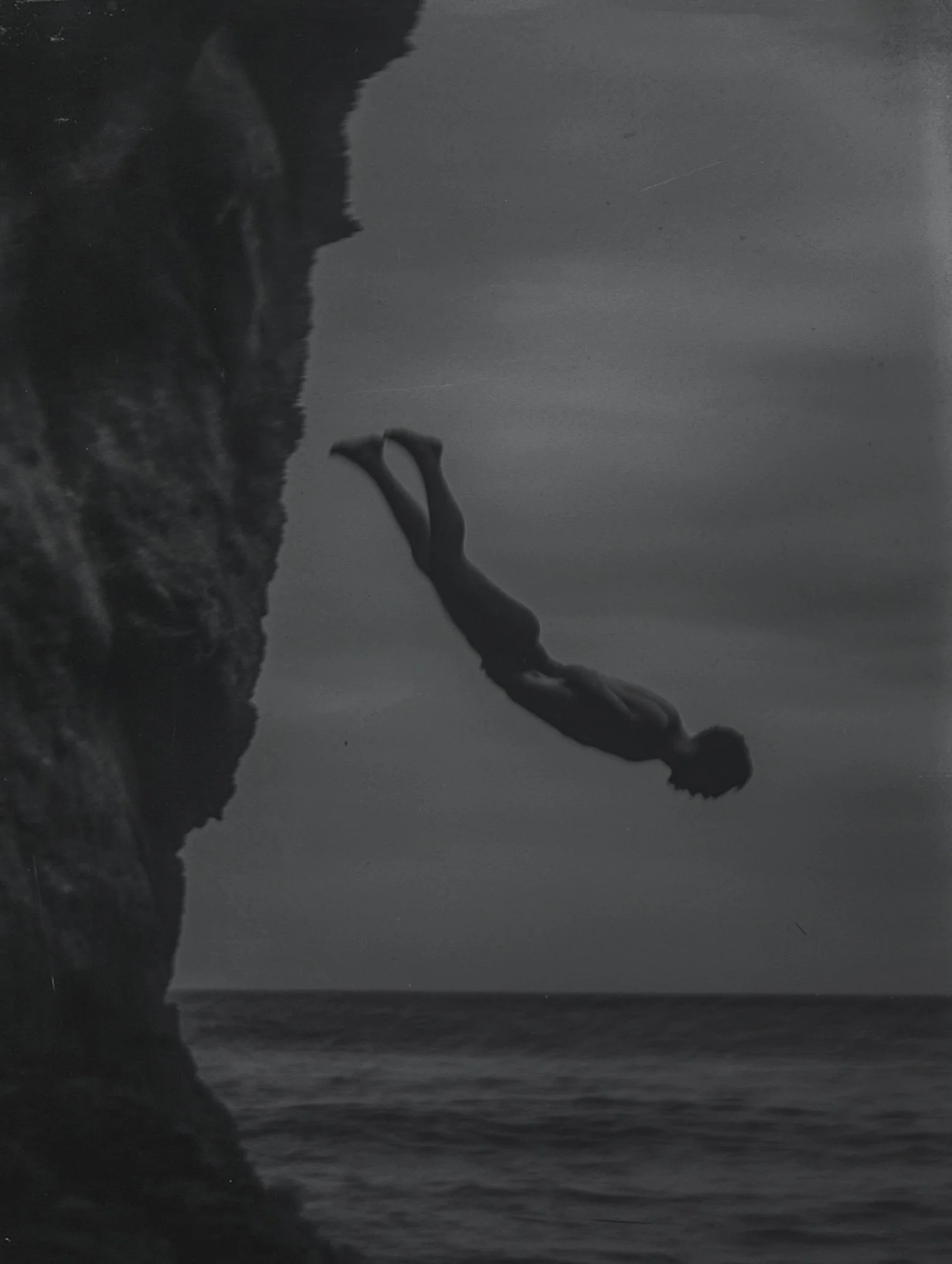 amani2464_a_photograph_of_a_figure_jumping_off_a_cliff_into_t_53e10f2d-2af2-42c6-8f26-50e9983e9b41_1-2.jpg