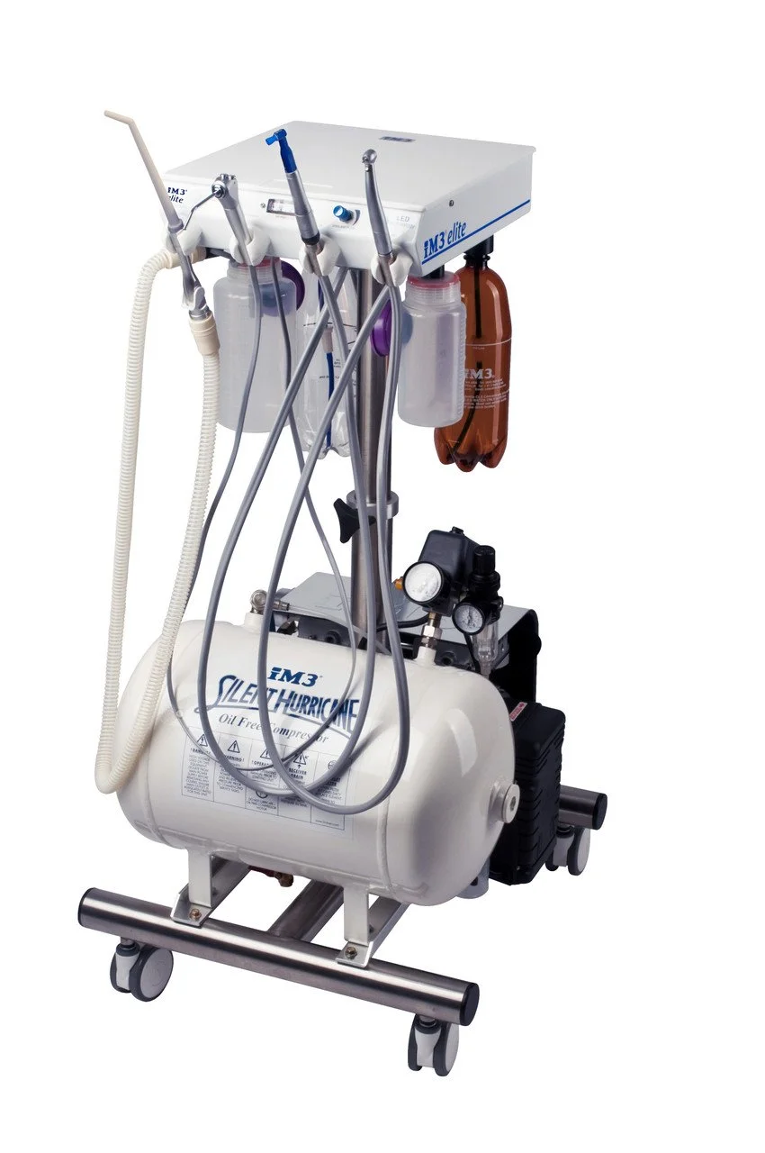 Medical or dental equipment with tubing, gauges, and a tank, possibly a surgical or dental suction device.