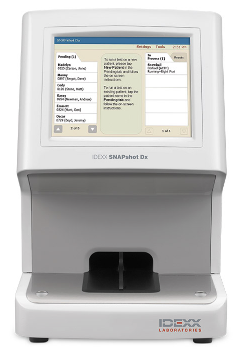 Medical device with a touchscreen display showing test scheduling information and patient list, labeled IDEXX SNAPshot Dx.