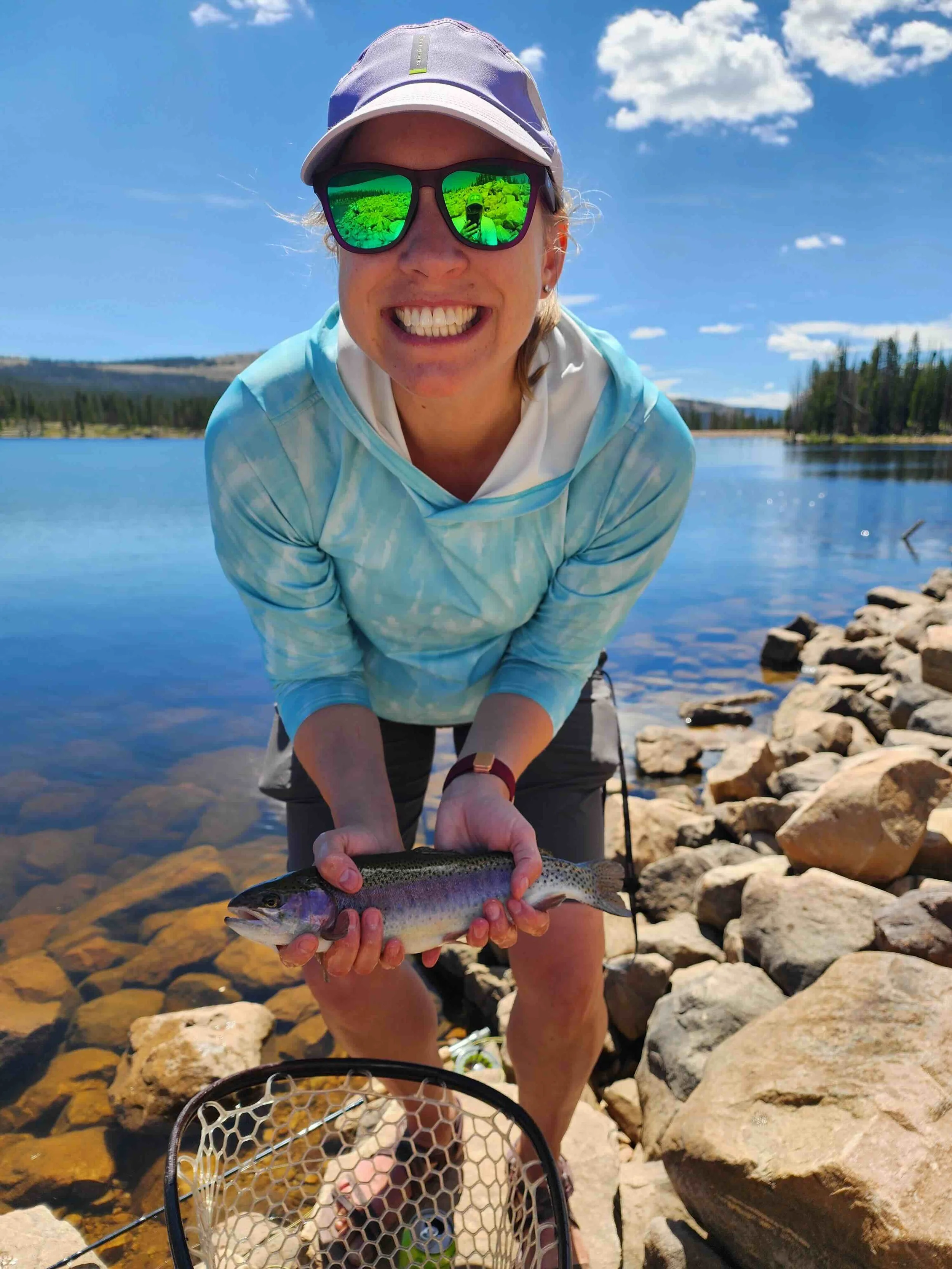 Client holding a healthy rainbow at Lost Lake, Uinta mountains