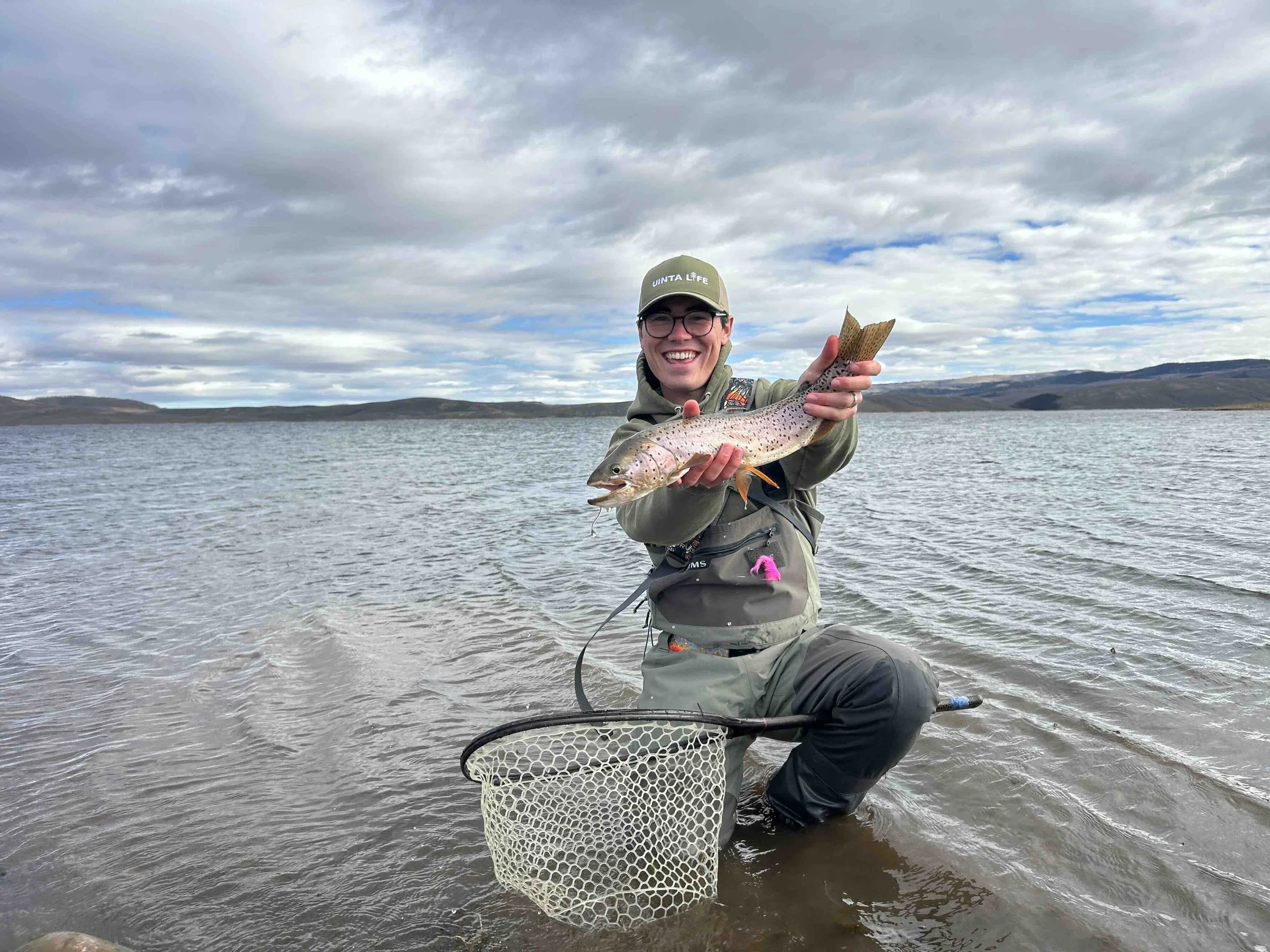 Alex posing with a cuttbow trout caught at Strawberry Reservoir