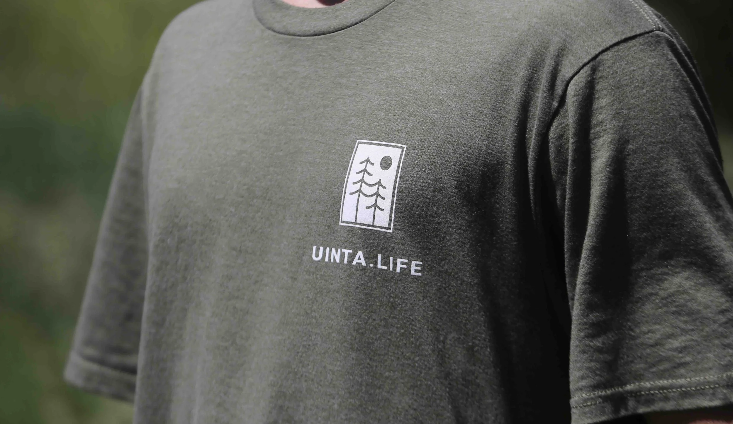 Basic green tee with a pine tree design