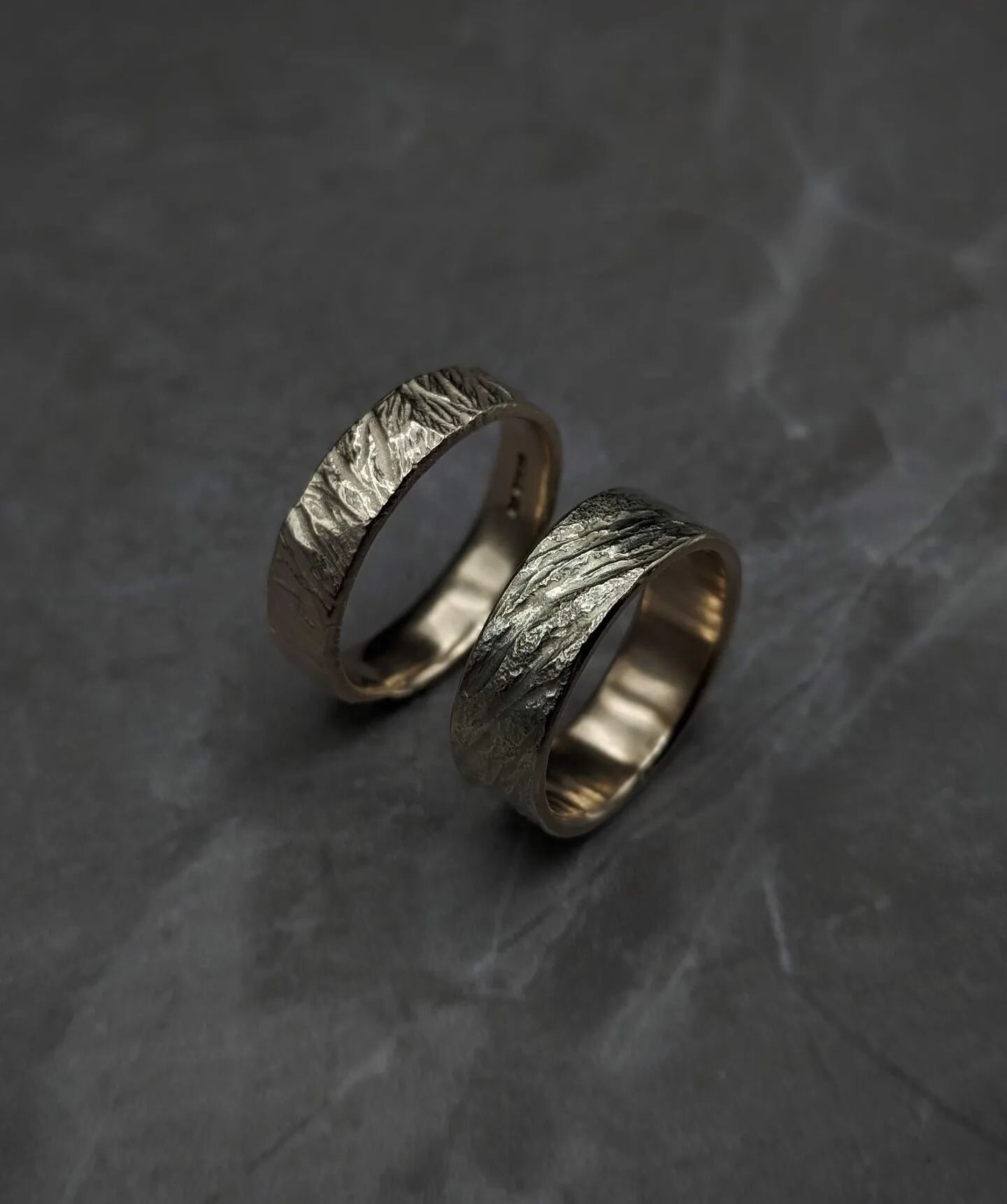 Wedding rings for N and M, collected this weekend. We discussed how I could incorporate details of a special place in the design so I picked out sections of photos they sent me to create textured samples in silver.

So here's the final rings in 9ct y