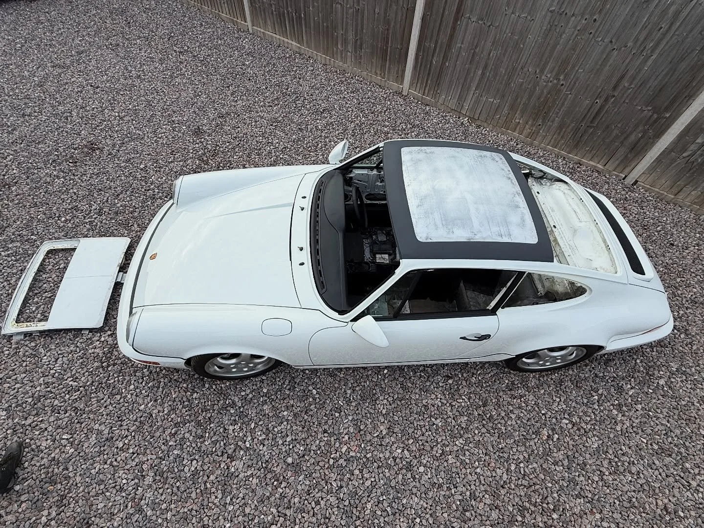 Porsche 964 sunroof delete. Butt welding a panel like this is extremely difficult. The weld can easily cause the panel to sink and loose its shape. Aaron spent the first week wheeling up the new roof and getting it to the correct sweep. The second we