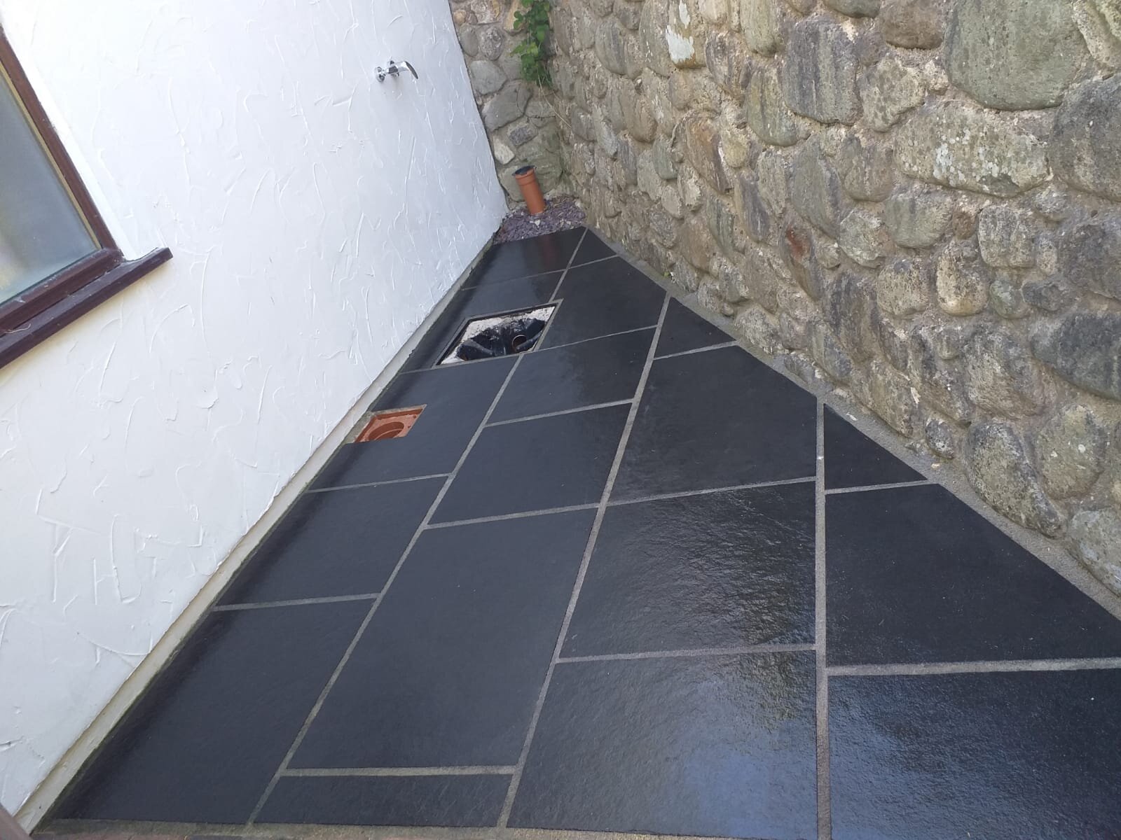 side slabed shower area in courtyard