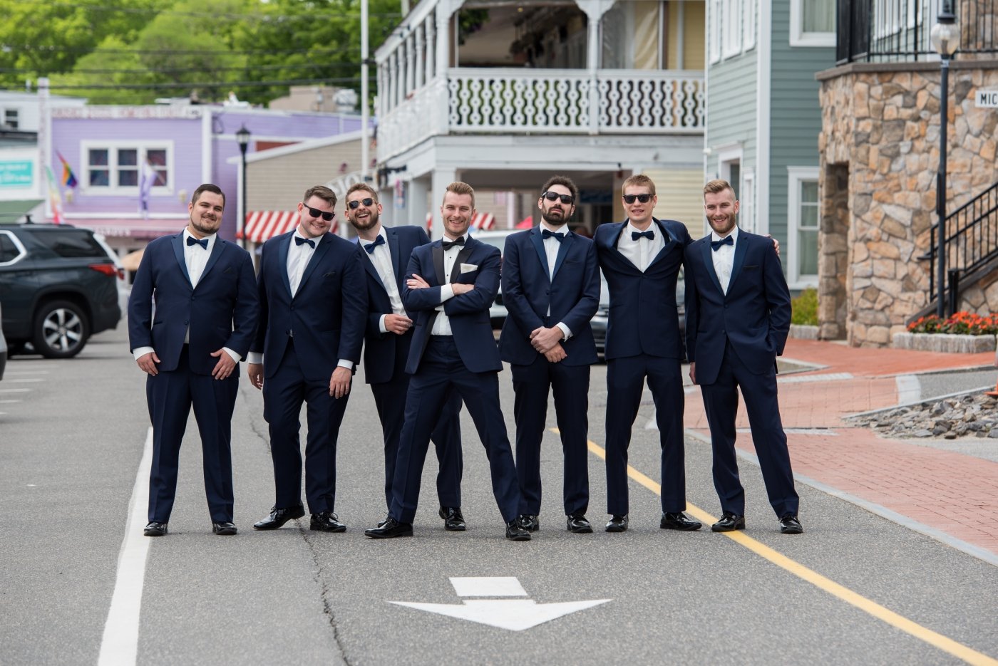 groomsmen in navy suits for summer wedding