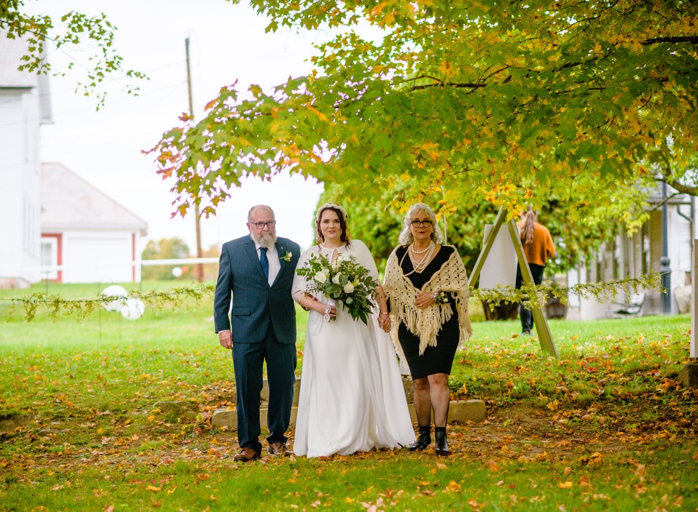 bride walking down aisle at outdoor wedding